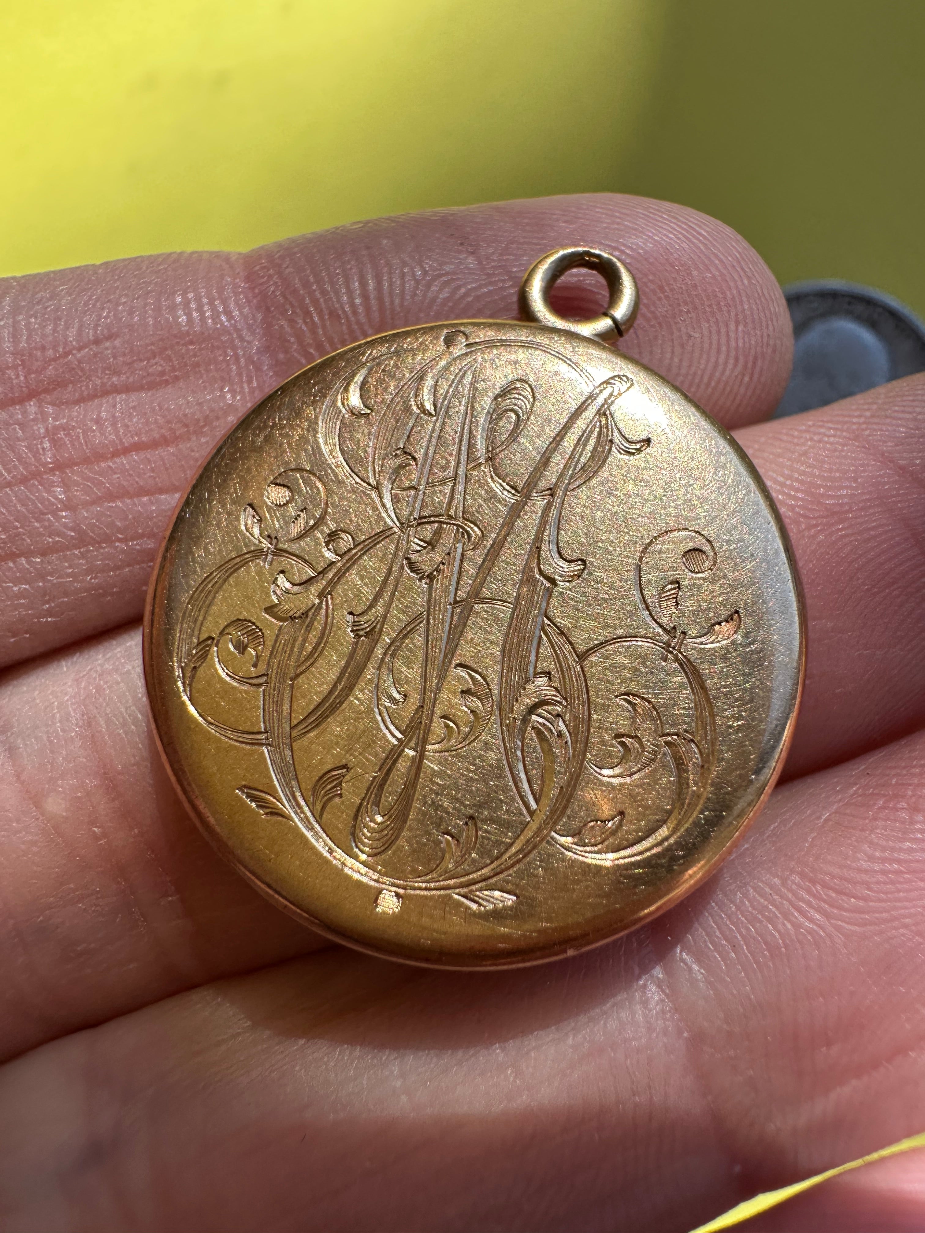antique round engraved locket