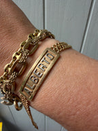 18k gold double curb ID bracelet with raised ALBERTO