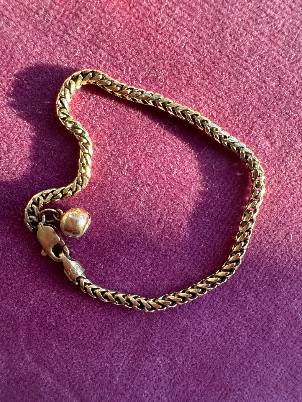 18k gold rounded wheat bracelet with jingle bell