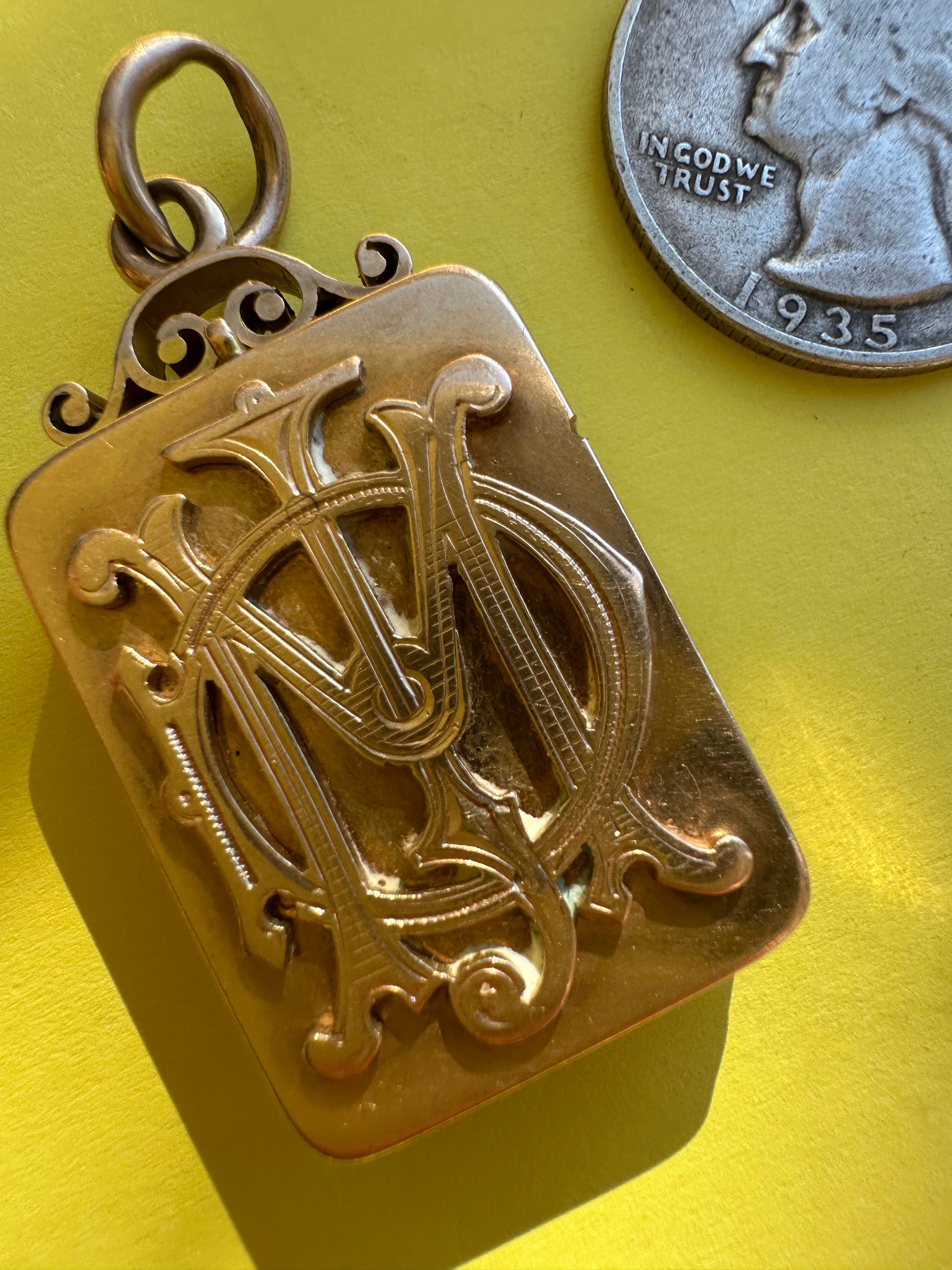 antique two sided locket with elk and monogram