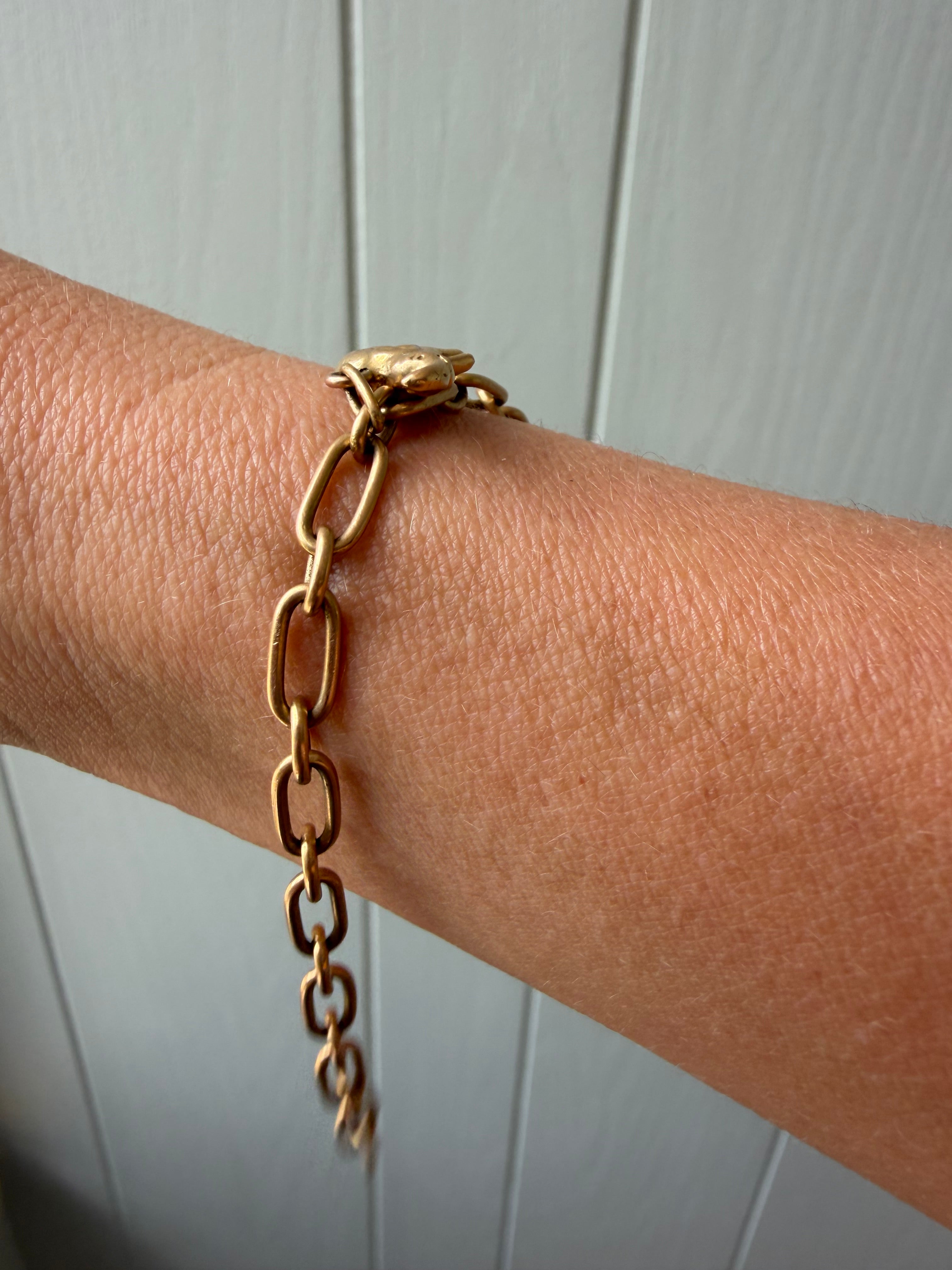 18k gold oval link with puffy elephant bracelet