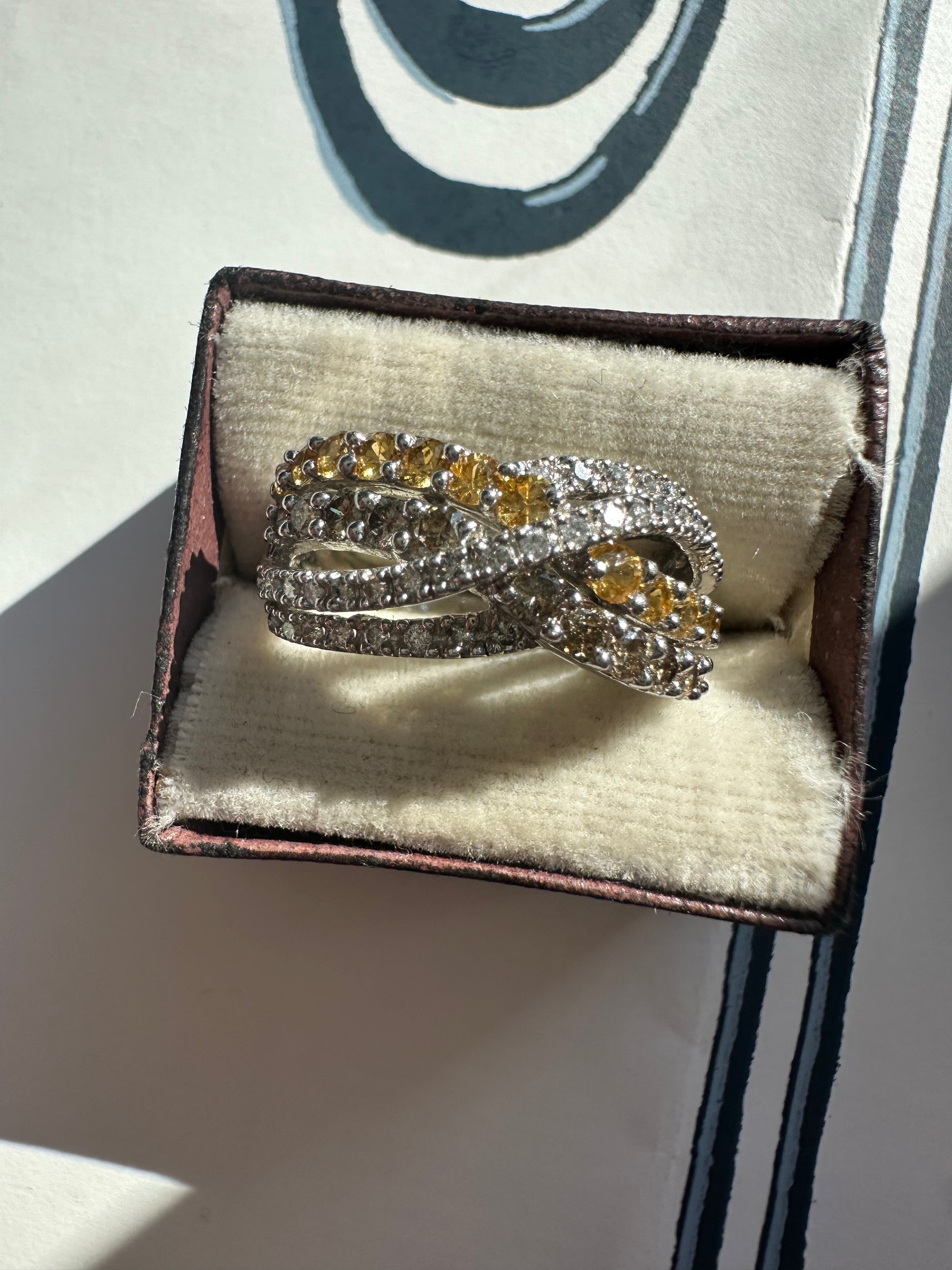 yellow sapphire and diamond crossover ring