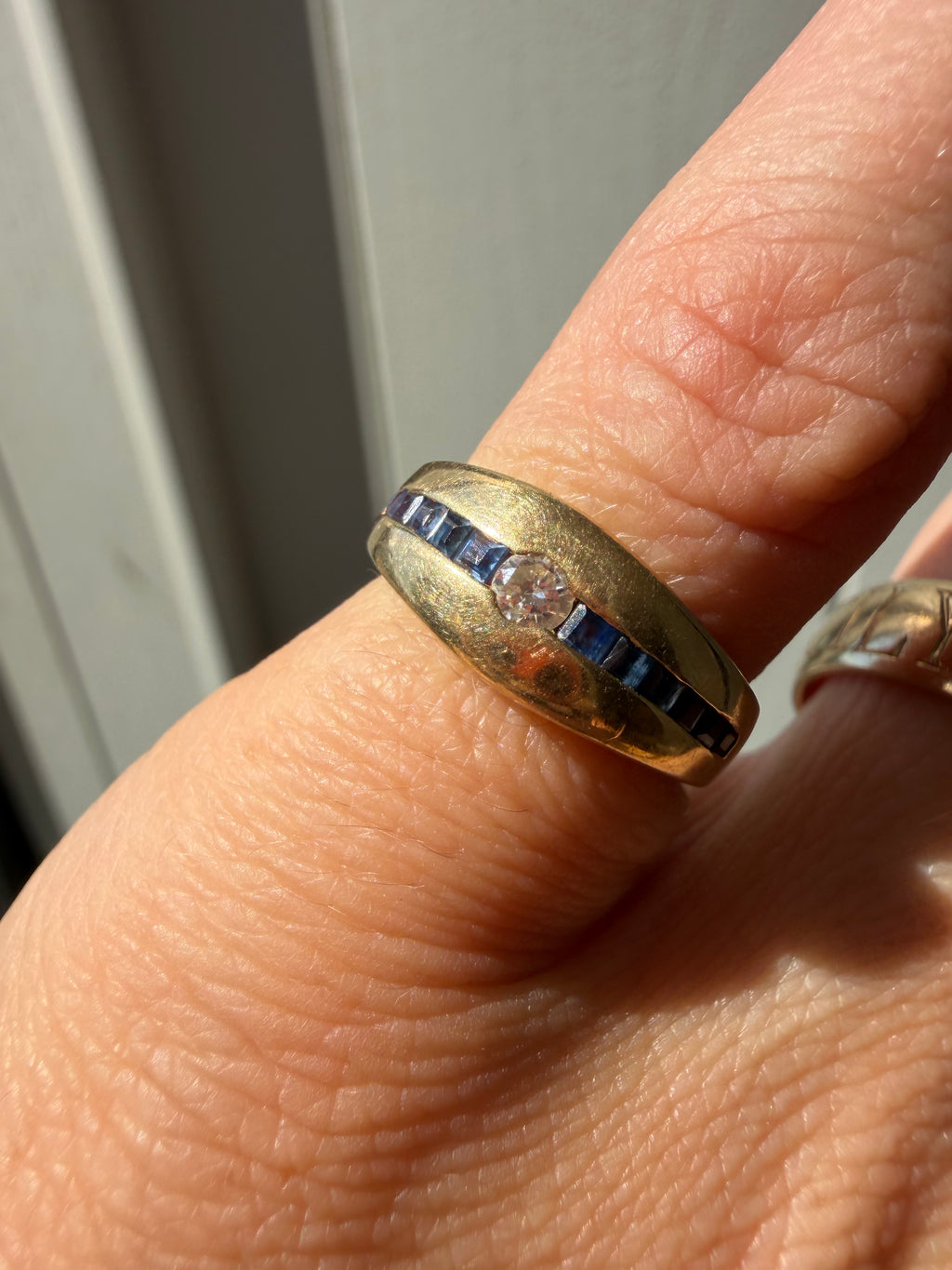gorgeous square cut sapphires and diamond in tapered gold band