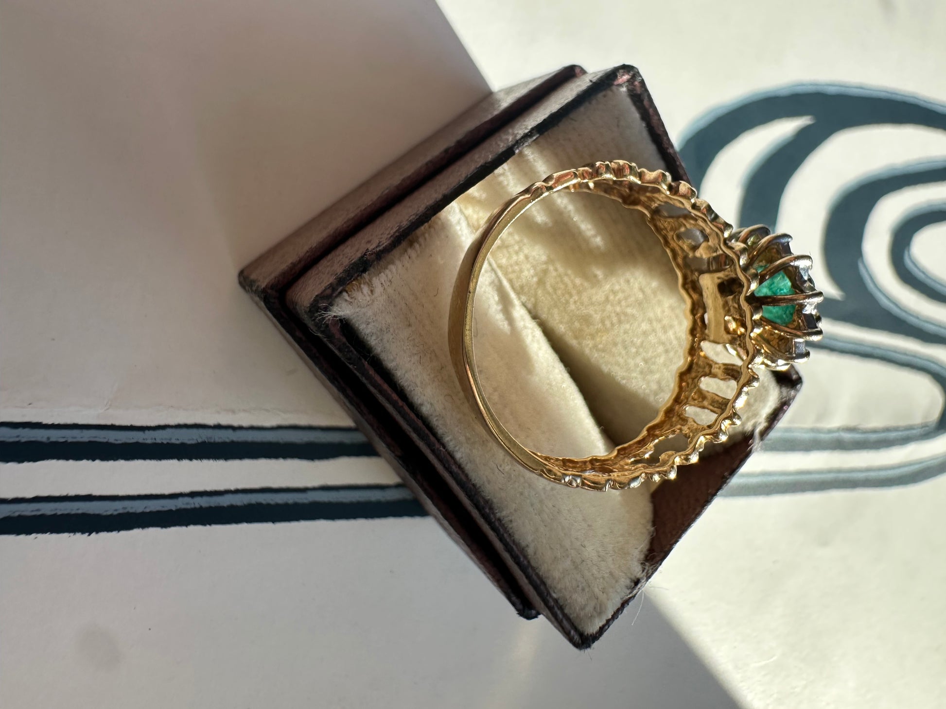oval cut emerald with diamond halo