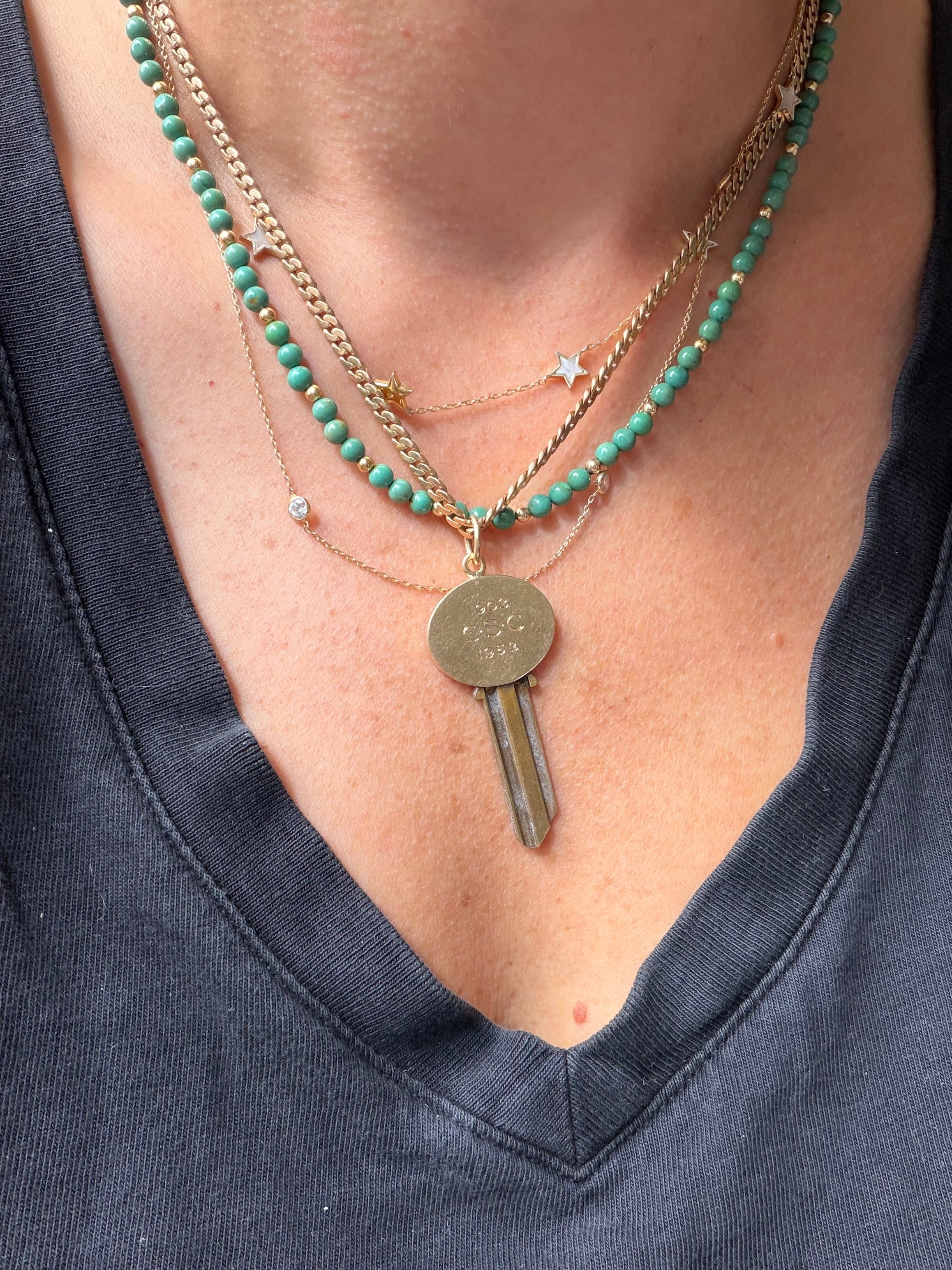 antique oval key pendant by Tiffany & Co.