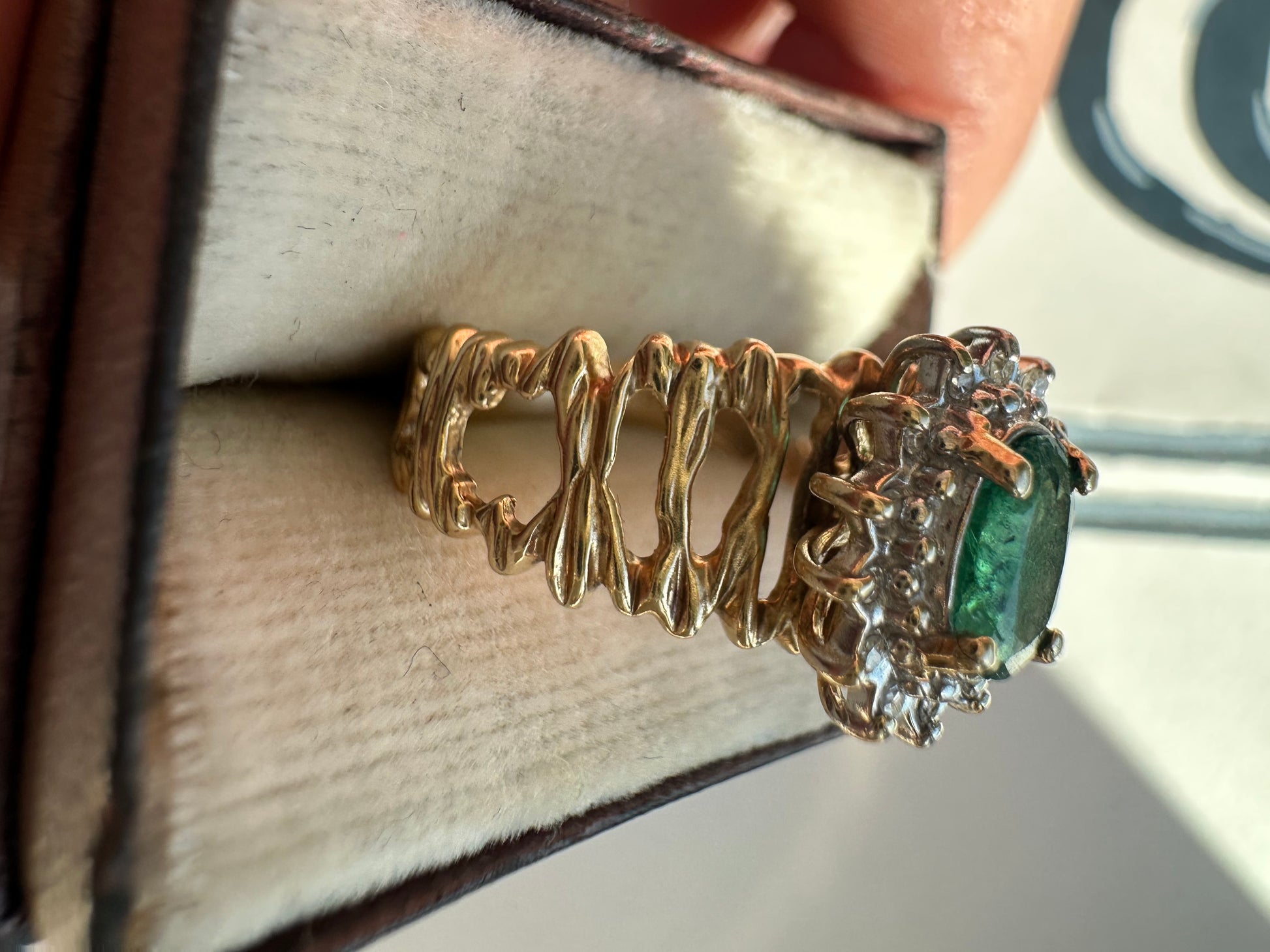 oval cut emerald with diamond halo