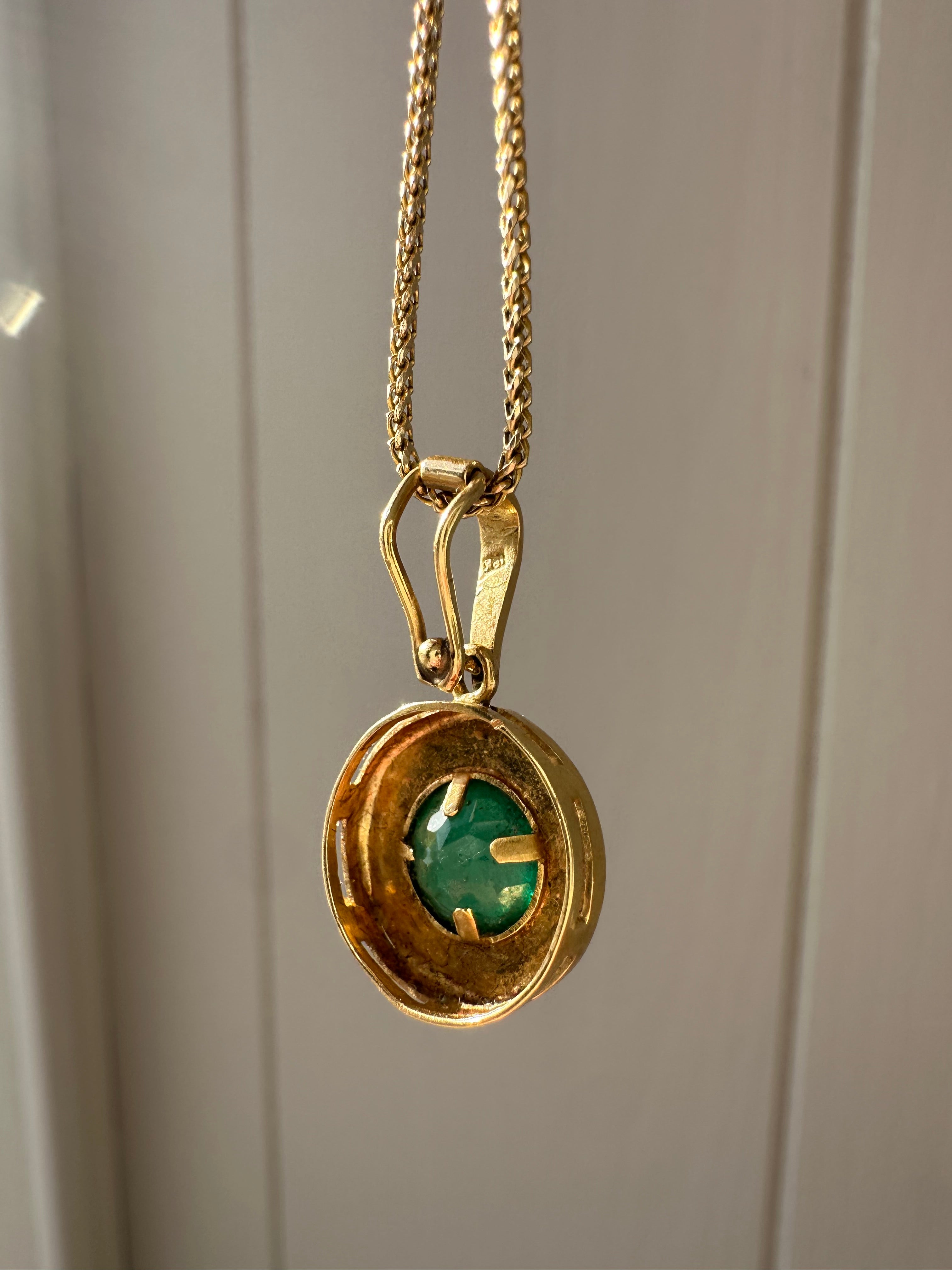 emerald in 18k bezel