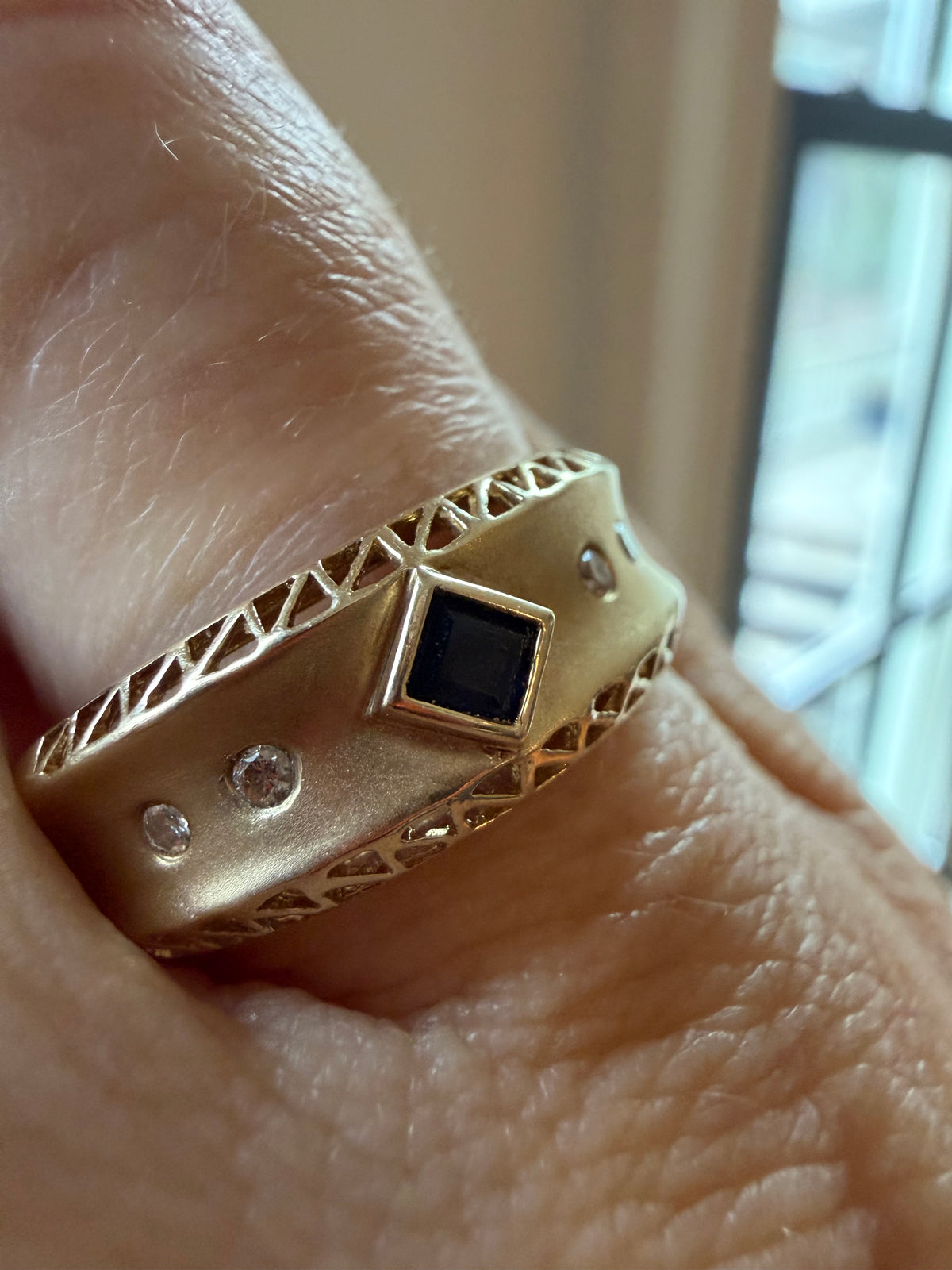 square cut sapphire and flush diamond ring