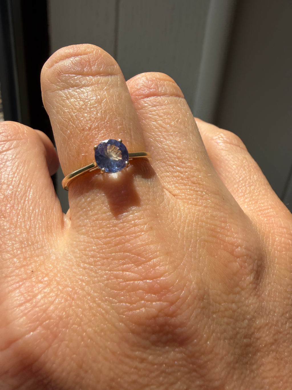 round cut solitaire tanzanite in 9k gold