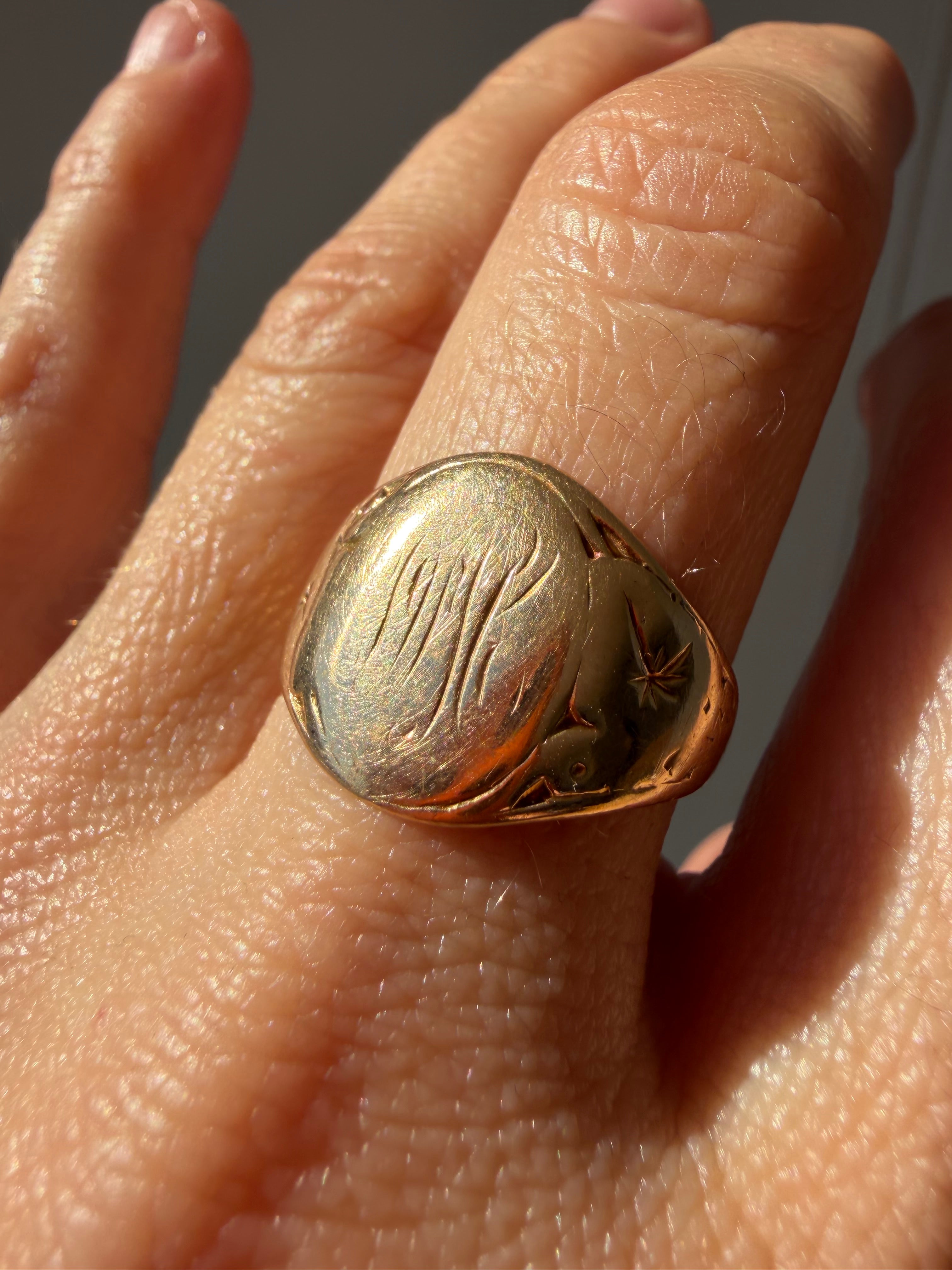 hand engraved worn signet with starbursts