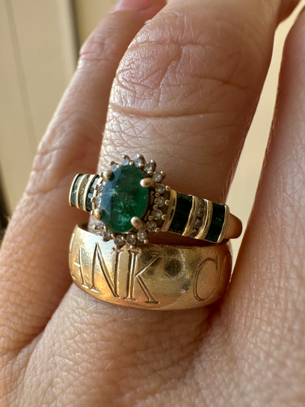 oval cut emerald with diamond halo ring