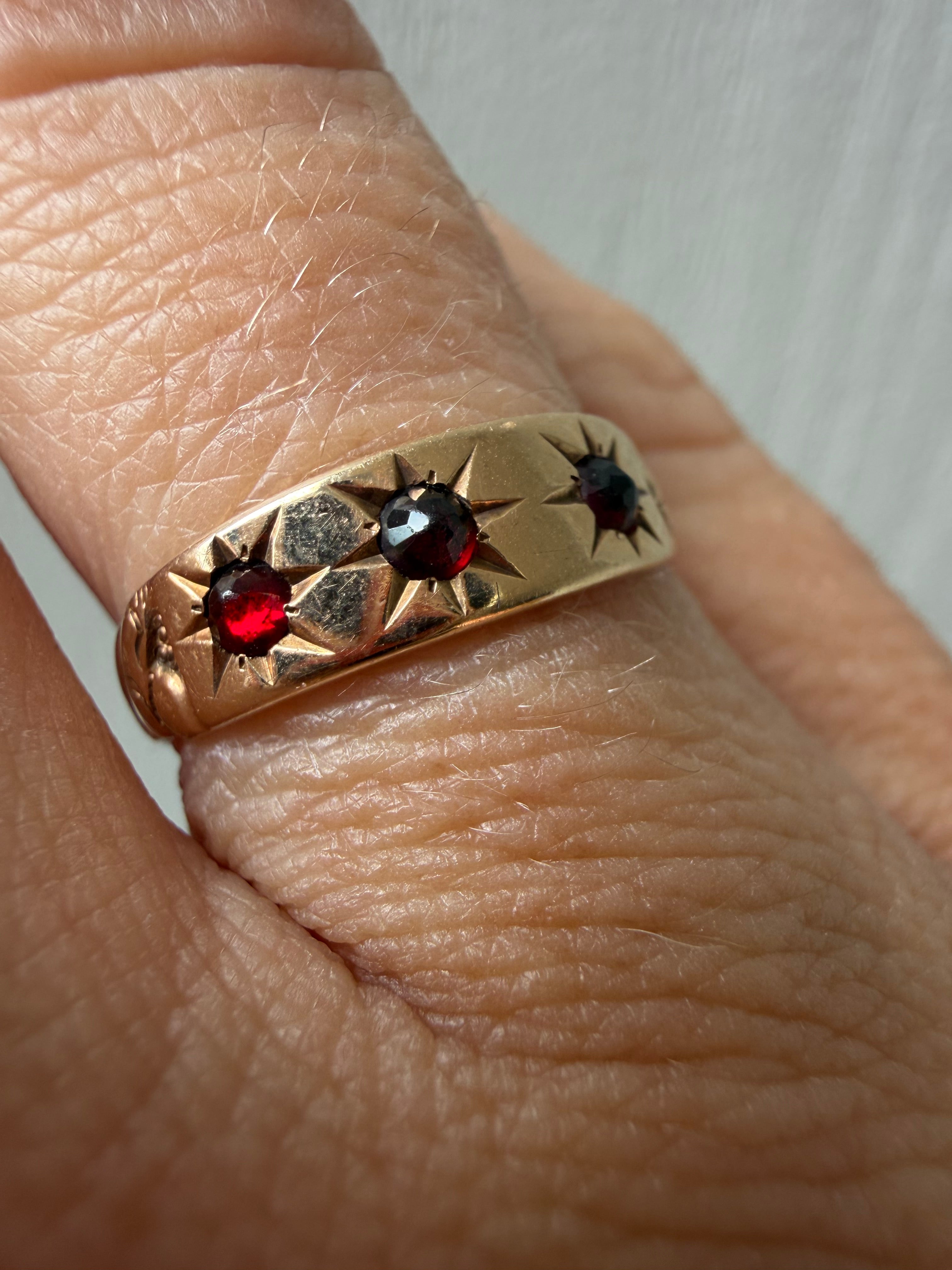 3 starburst garnet in 10k gold