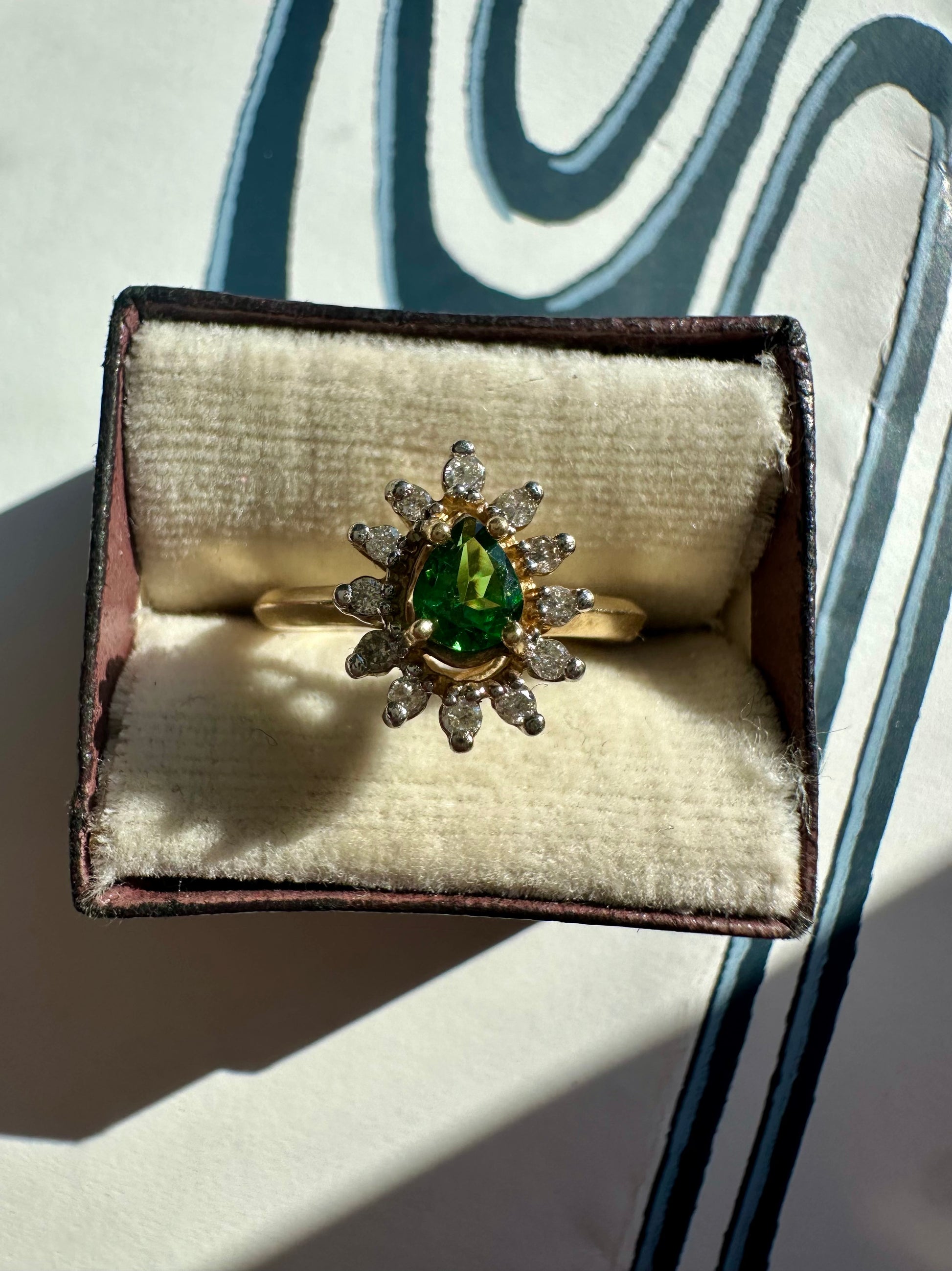 tsavorite garnet and diamond halo ring