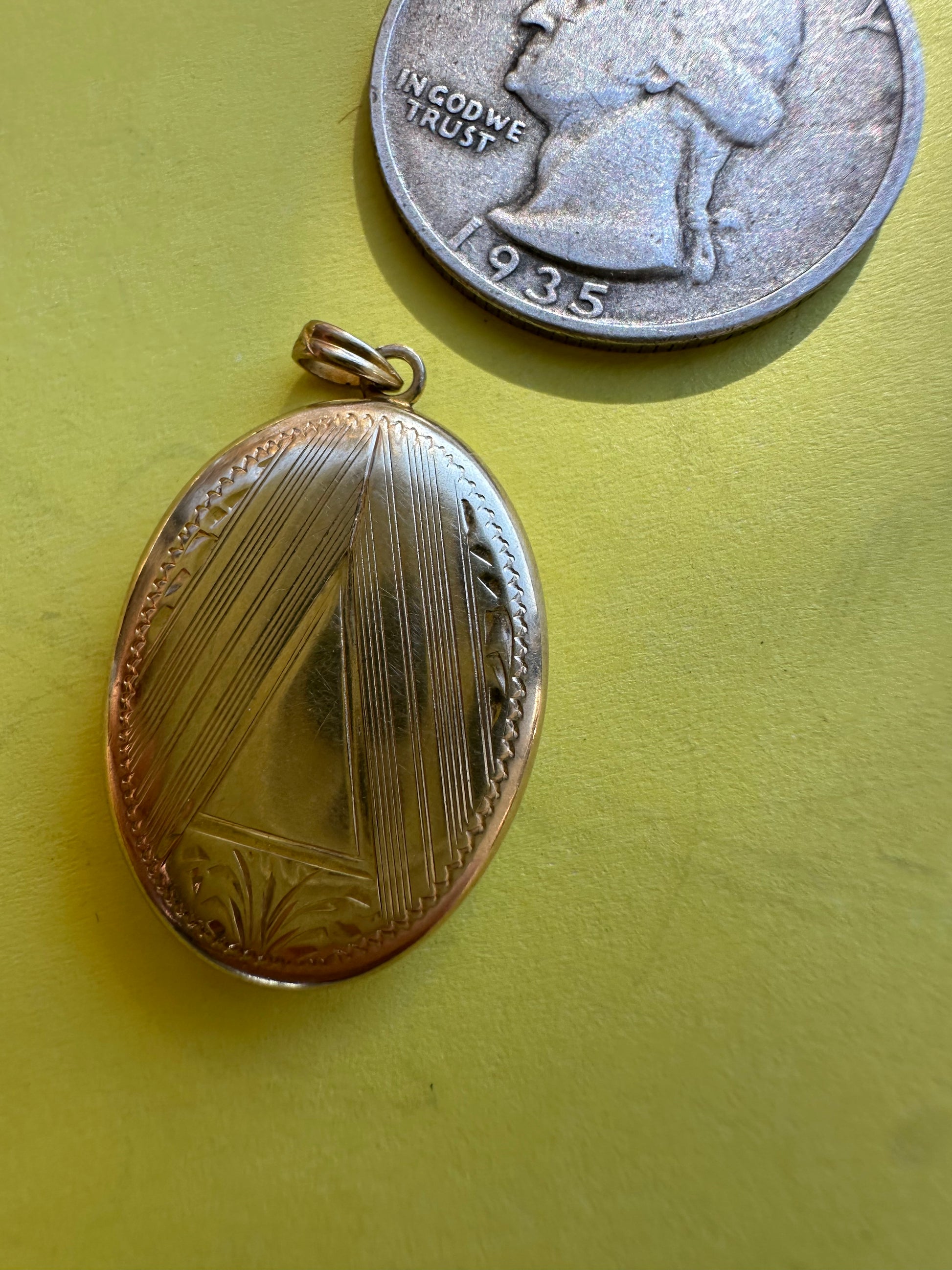 vintage oval locket with triangle