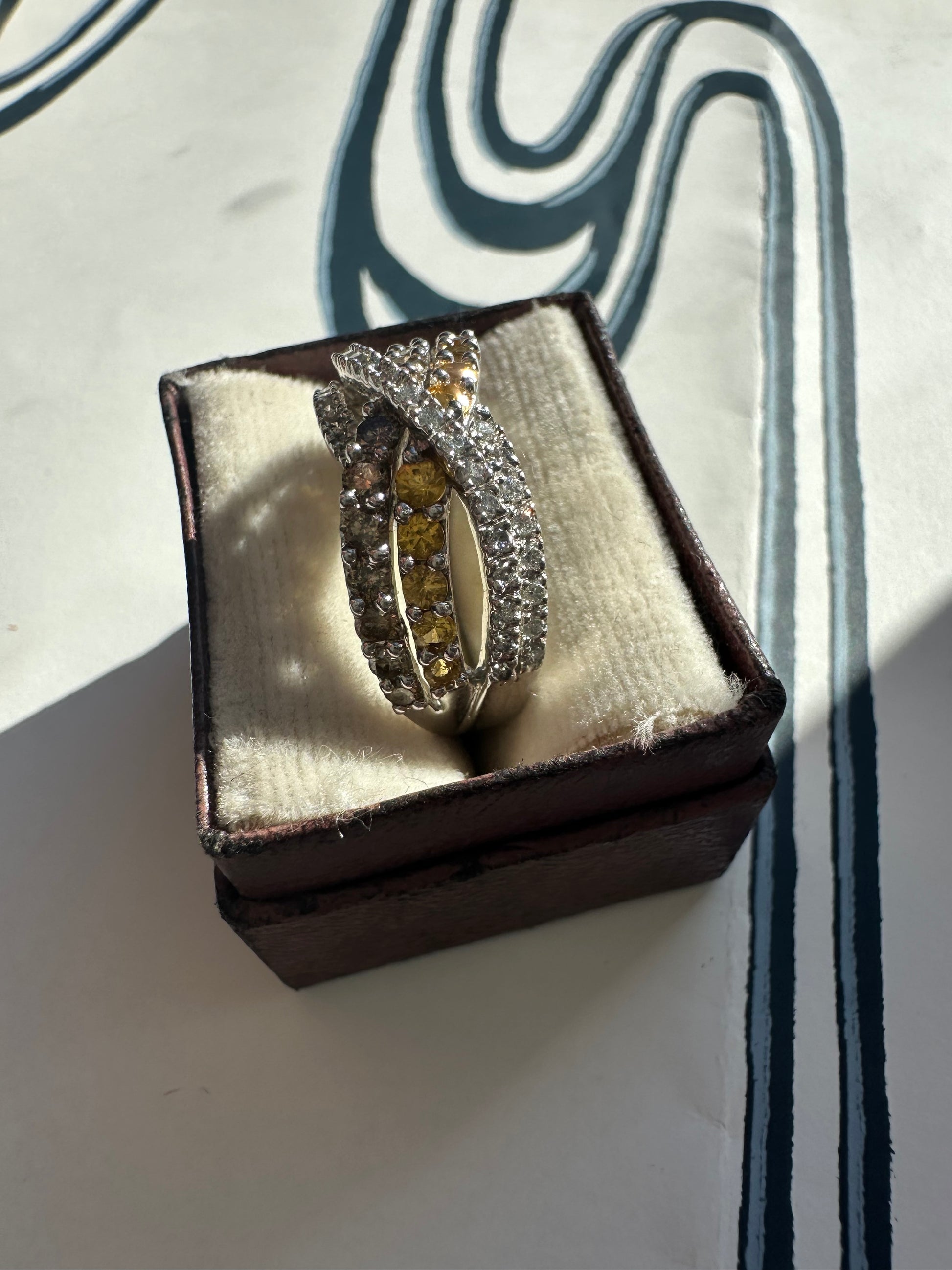 yellow sapphire and diamond crossover ring