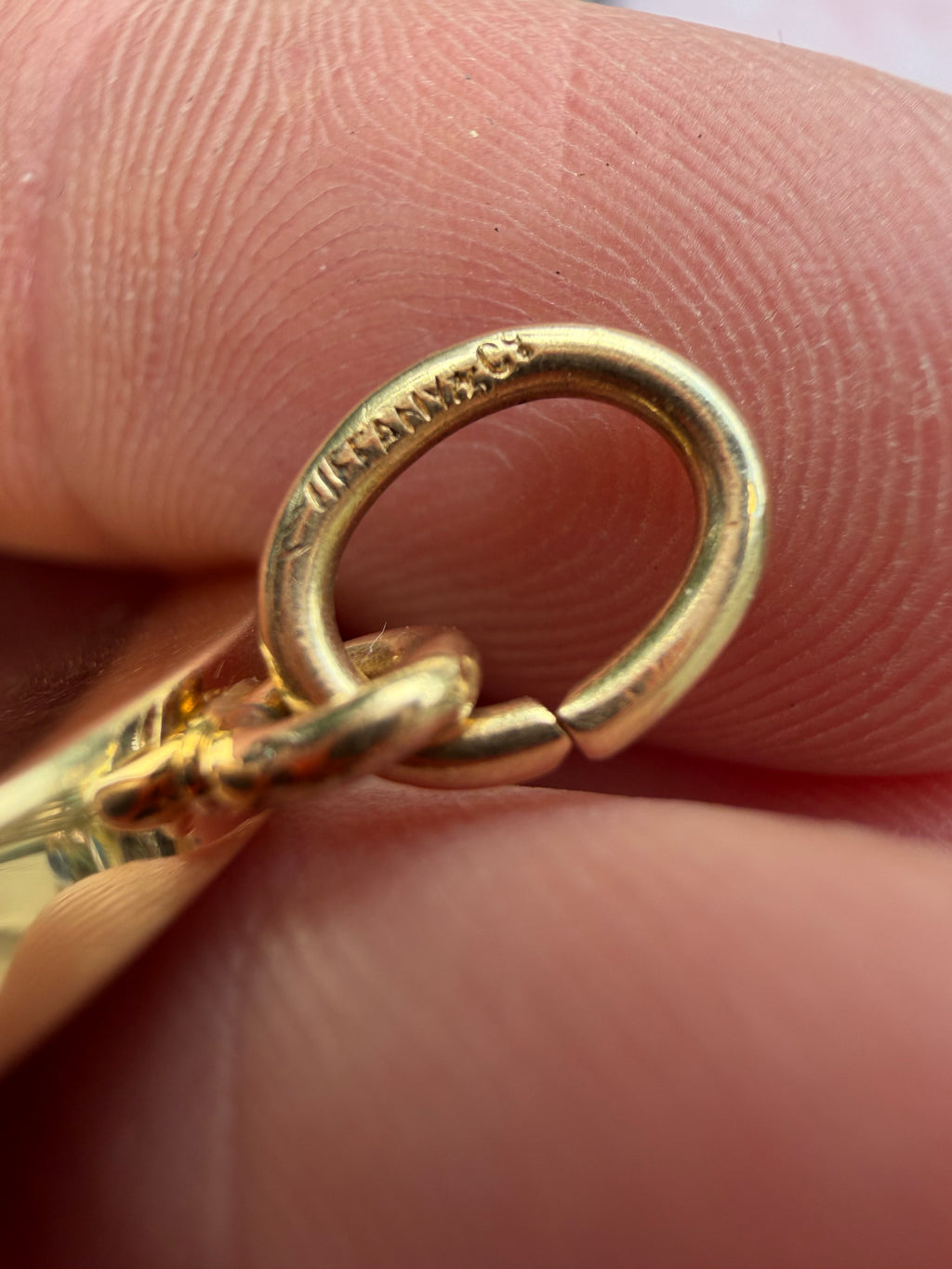 antique oval key pendant by Tiffany & Co.