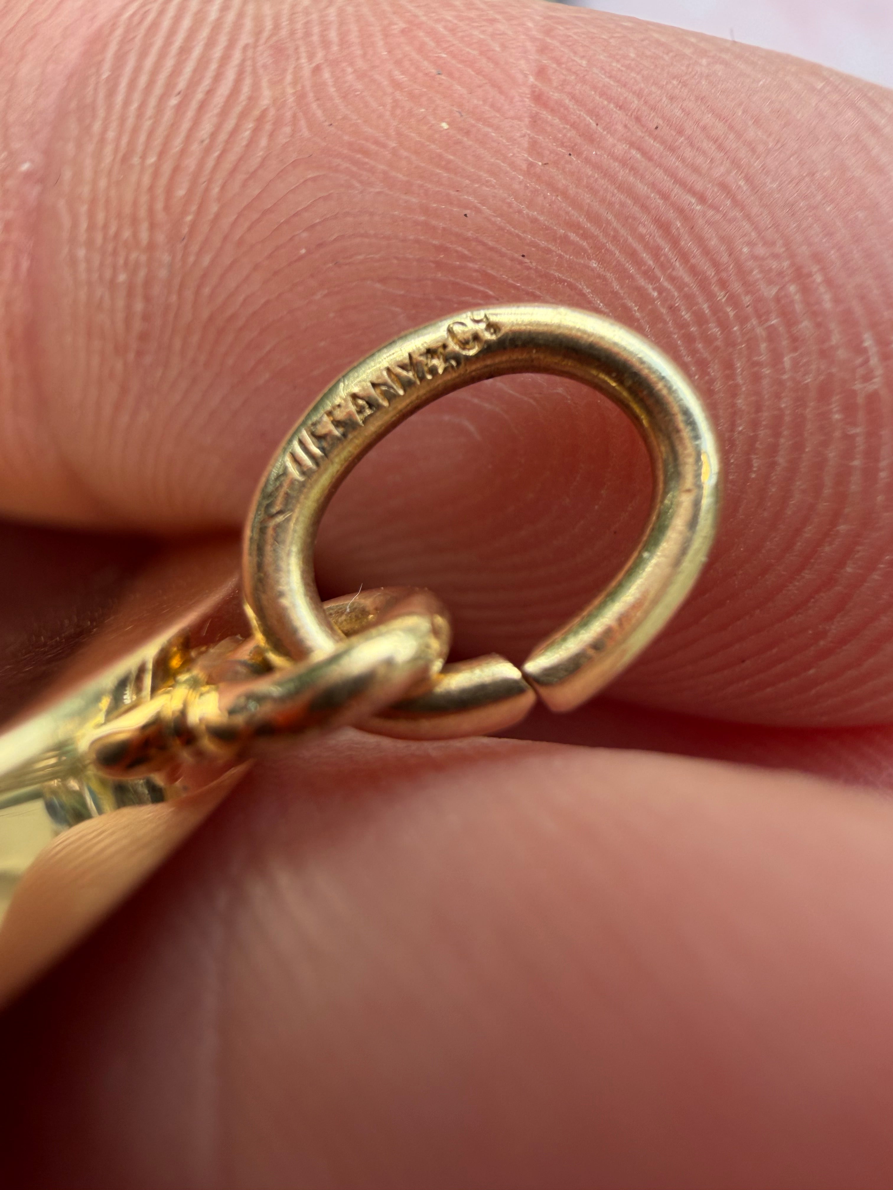 antique oval key pendant by Tiffany & Co.