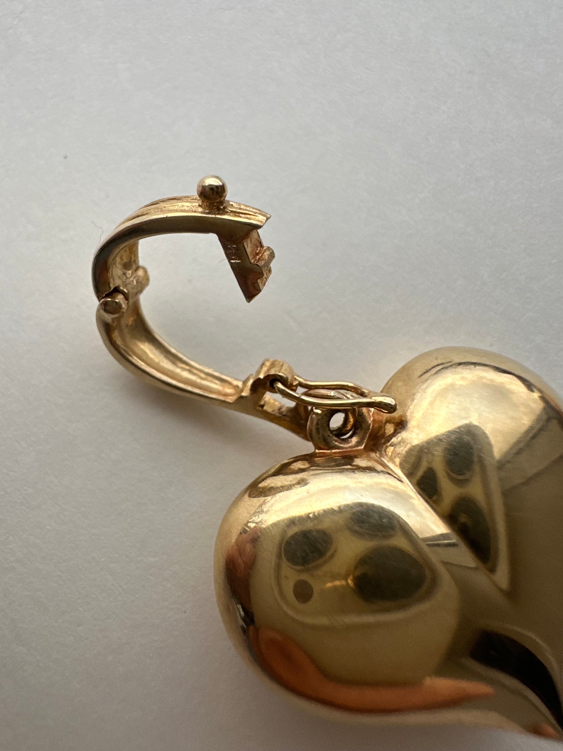 large puffed heart with gemstones and diamond