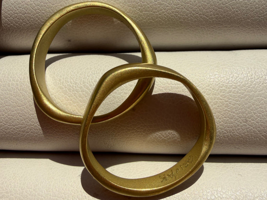 pair of 18k matte gold finish bands