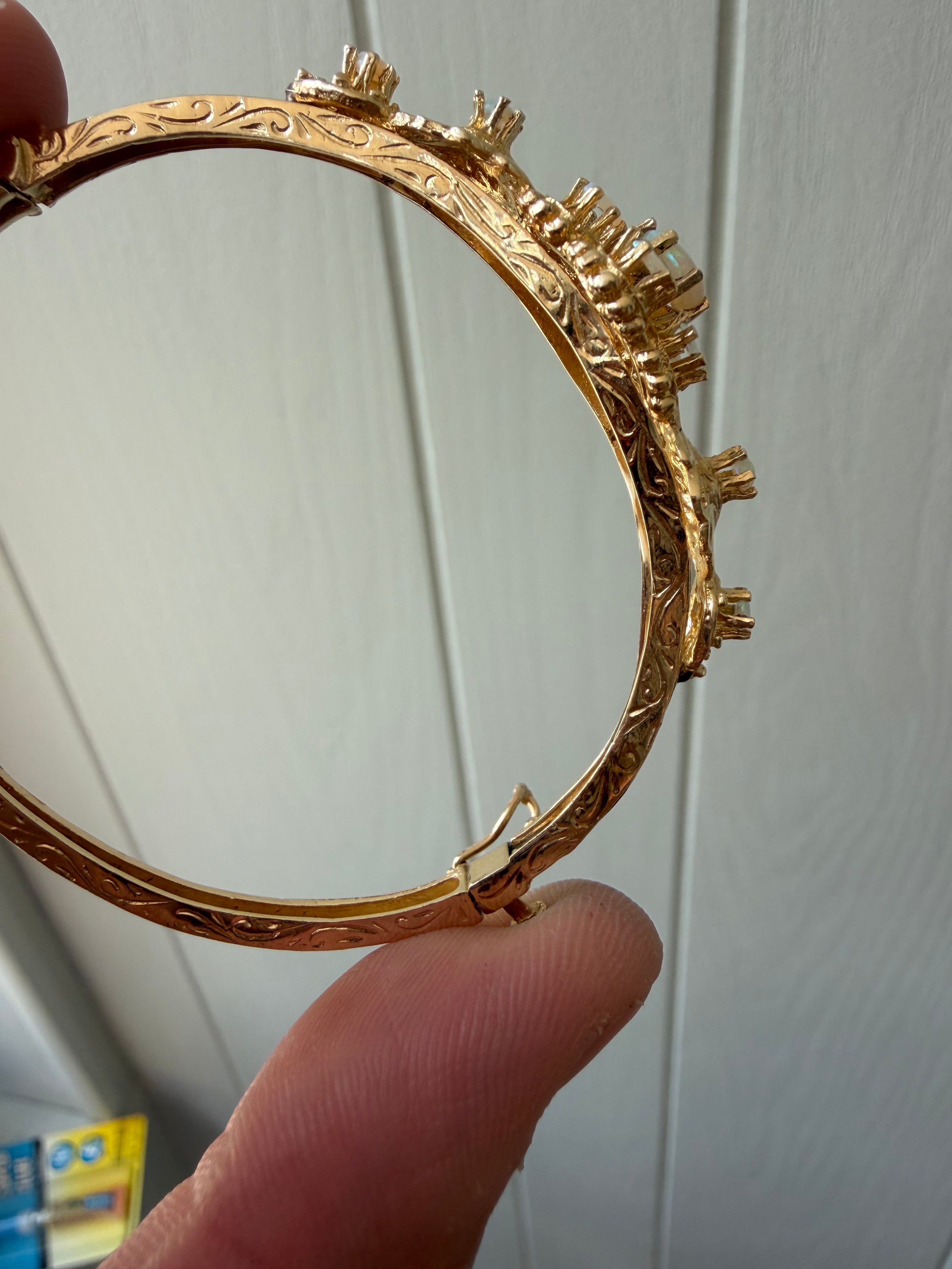 striking engraved opal burst hinge bangle