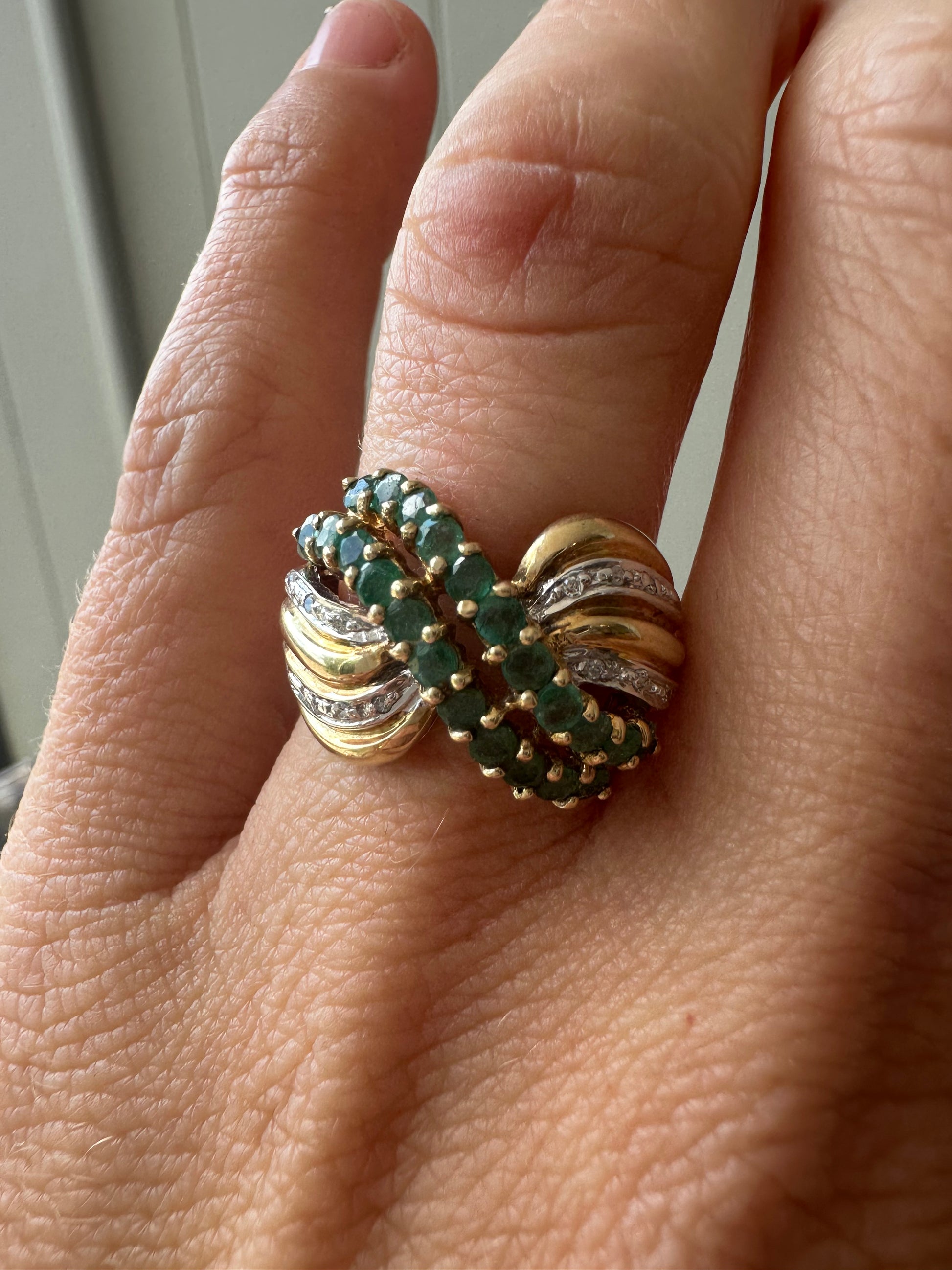 emerald and diamond swoop ring