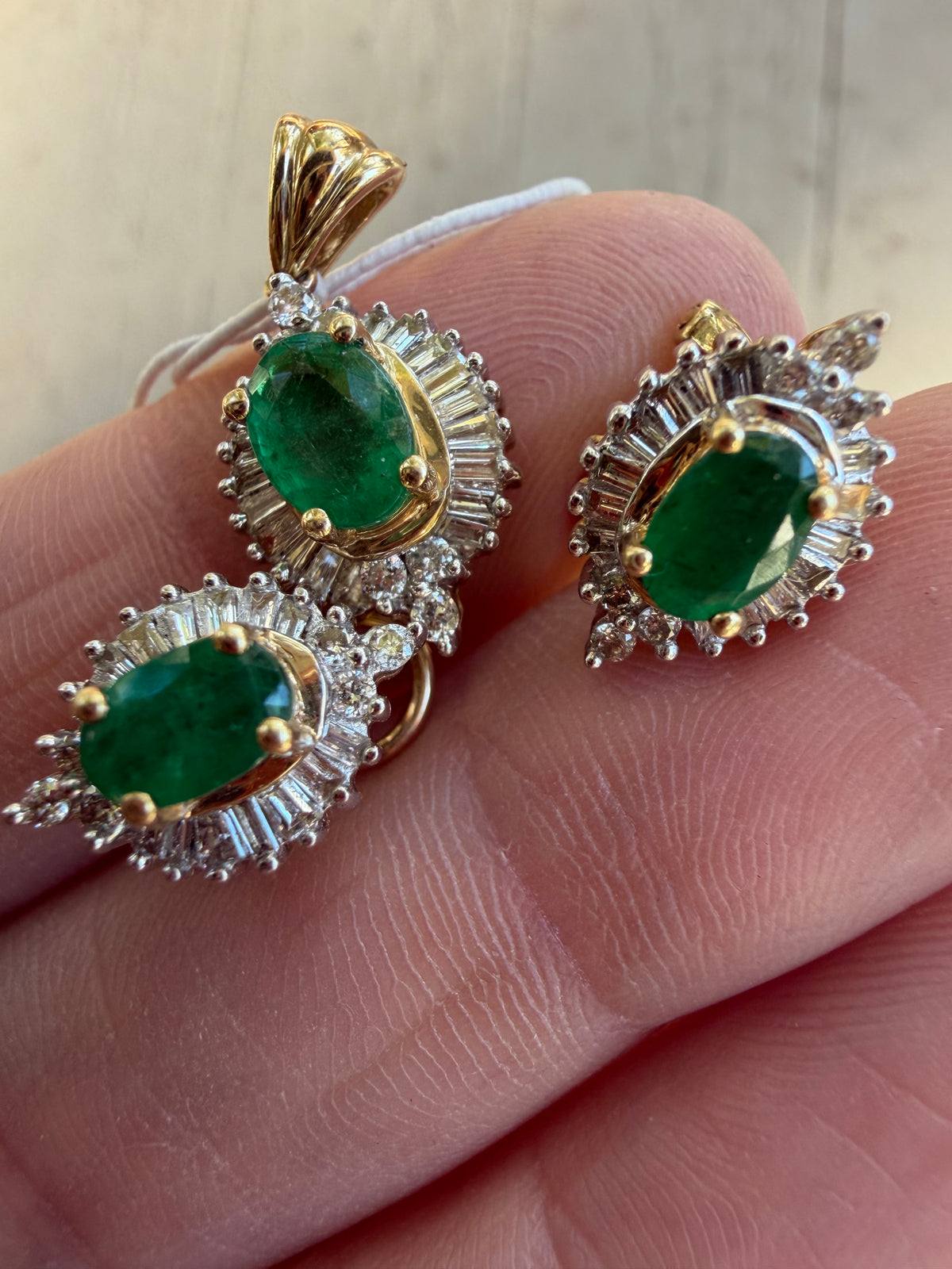 natural emerald and baguette diamond halo pendant