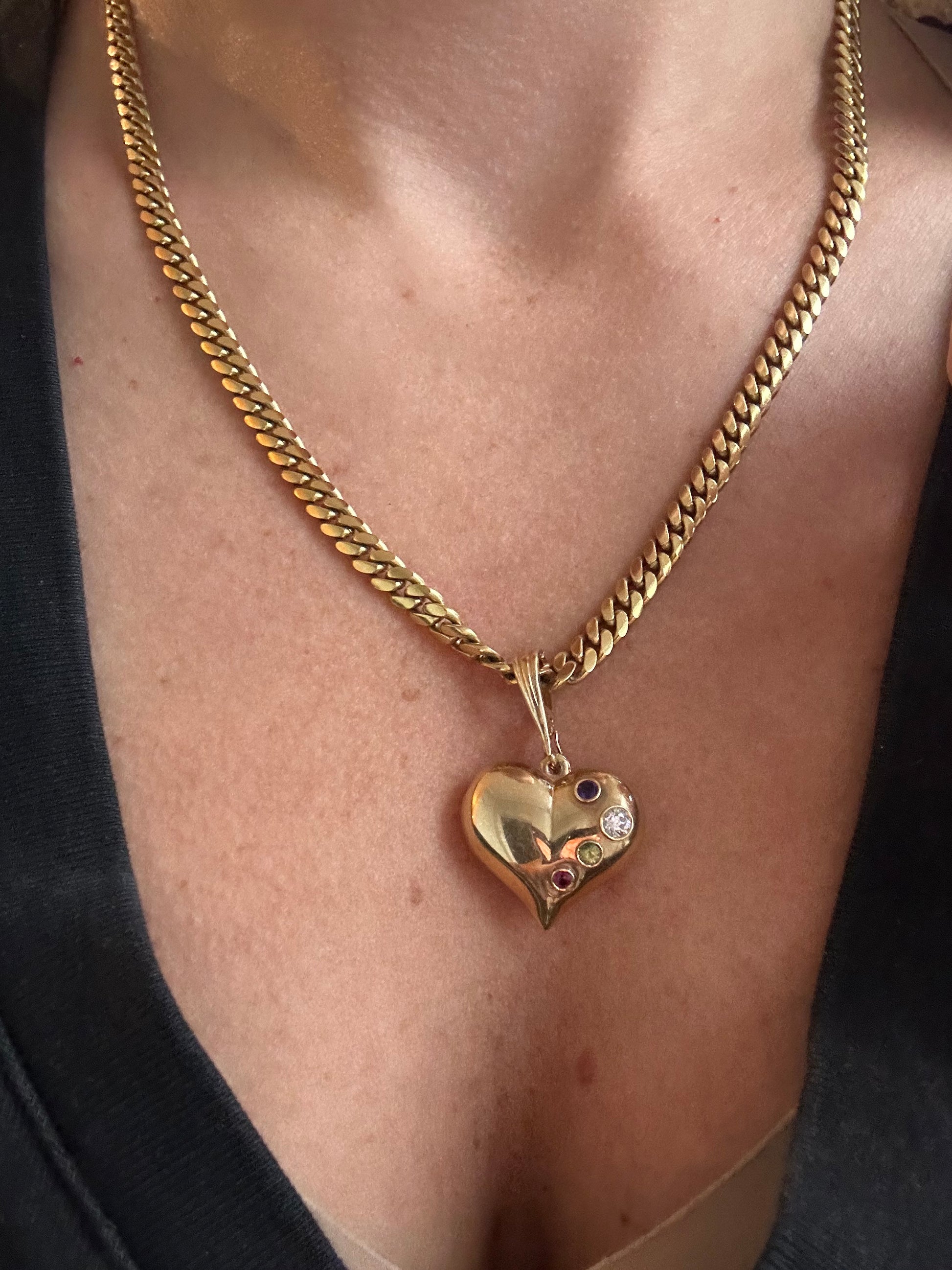 large puffed heart with gemstones and diamond