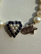 pearl strand with sapphire and pearl heart white gold clasp