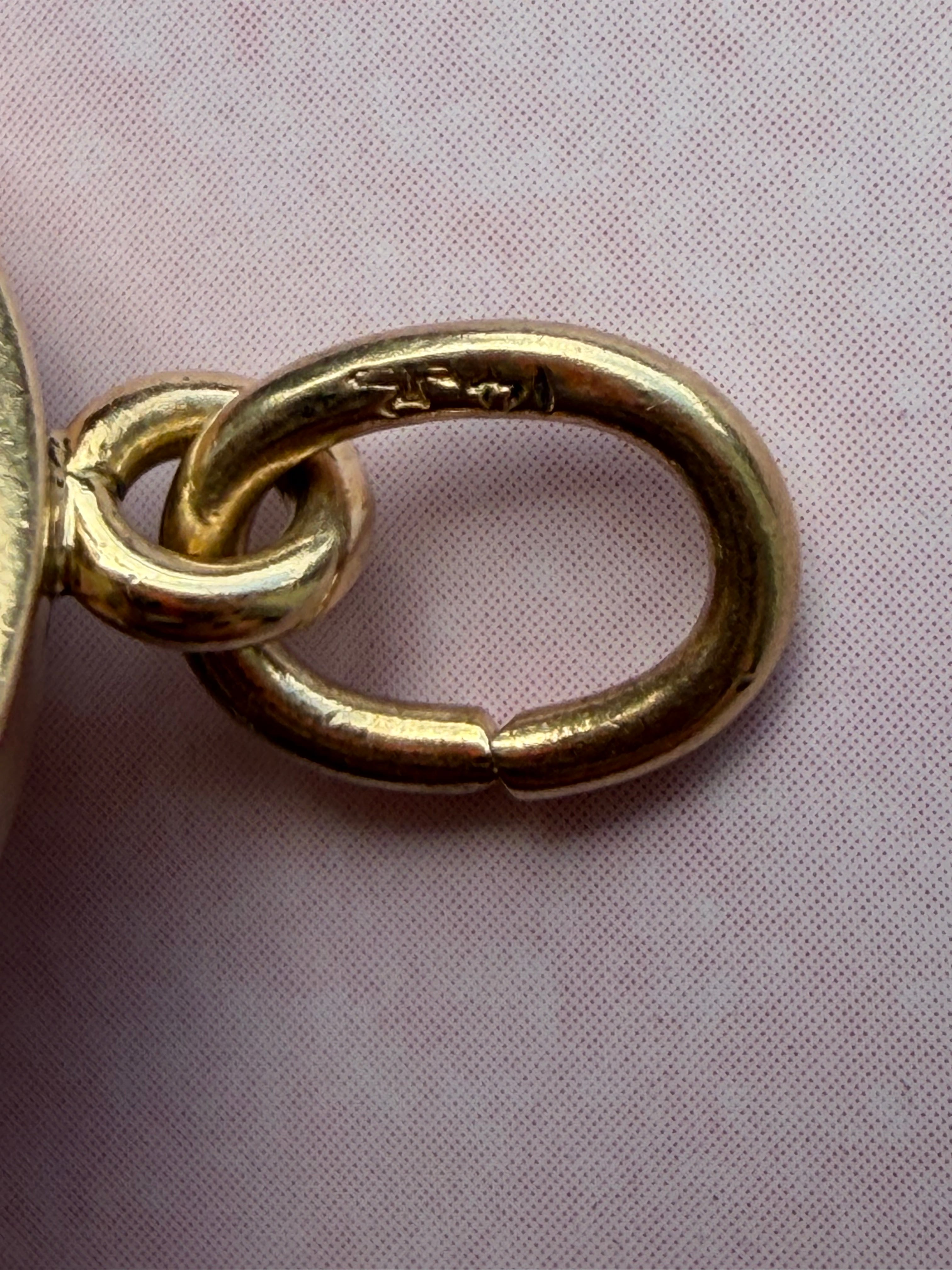 antique oval key pendant by Tiffany & Co.