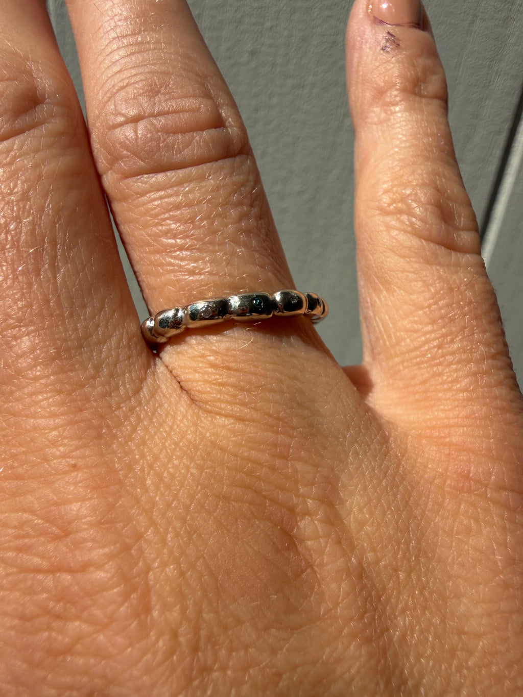 white gold bead band with blue and white diamonds