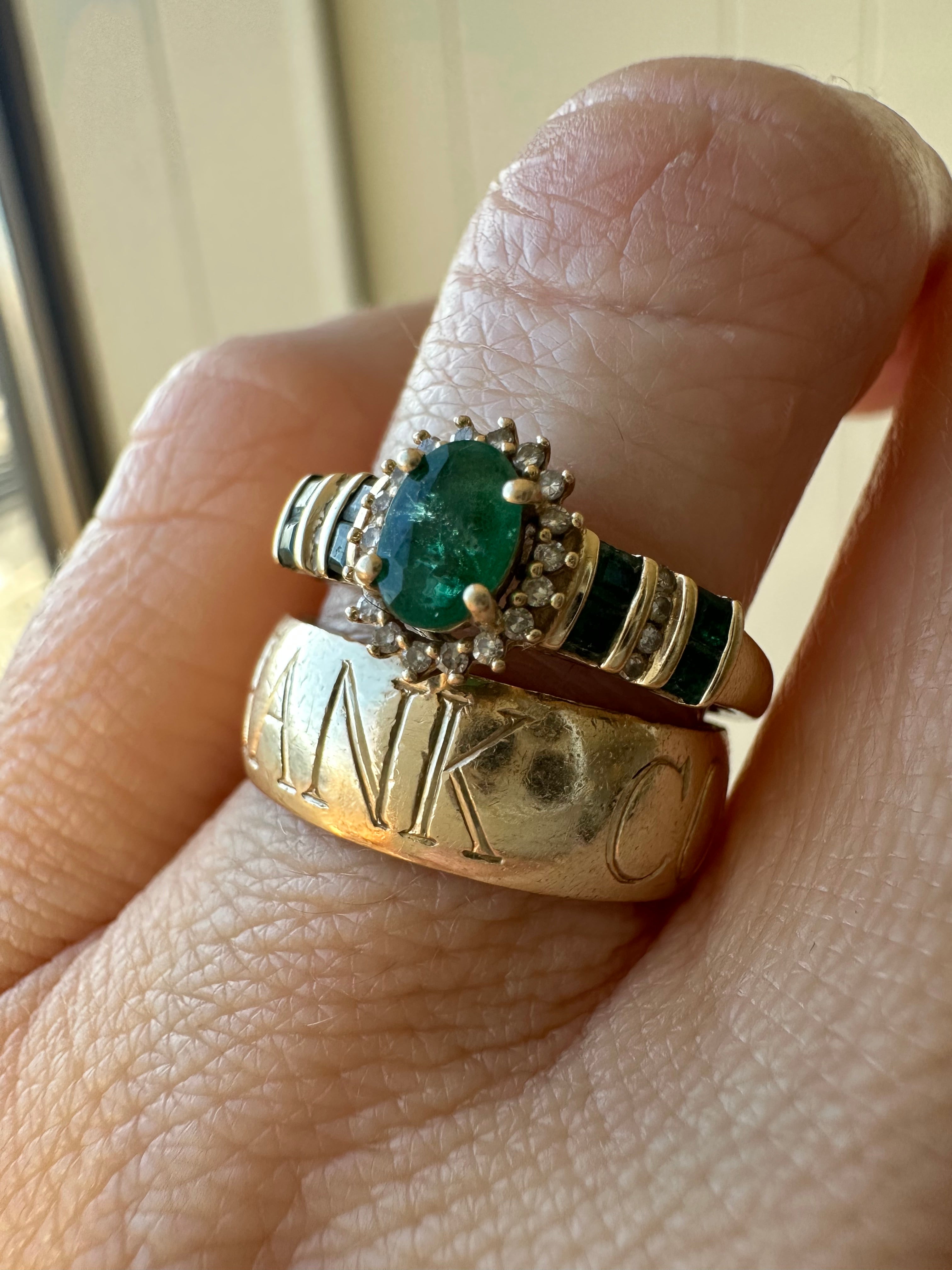 oval cut emerald with diamond halo ring