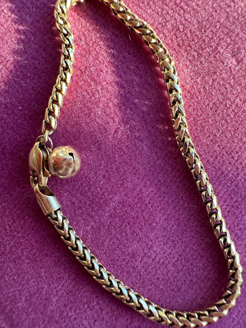 18k gold rounded wheat bracelet with jingle bell