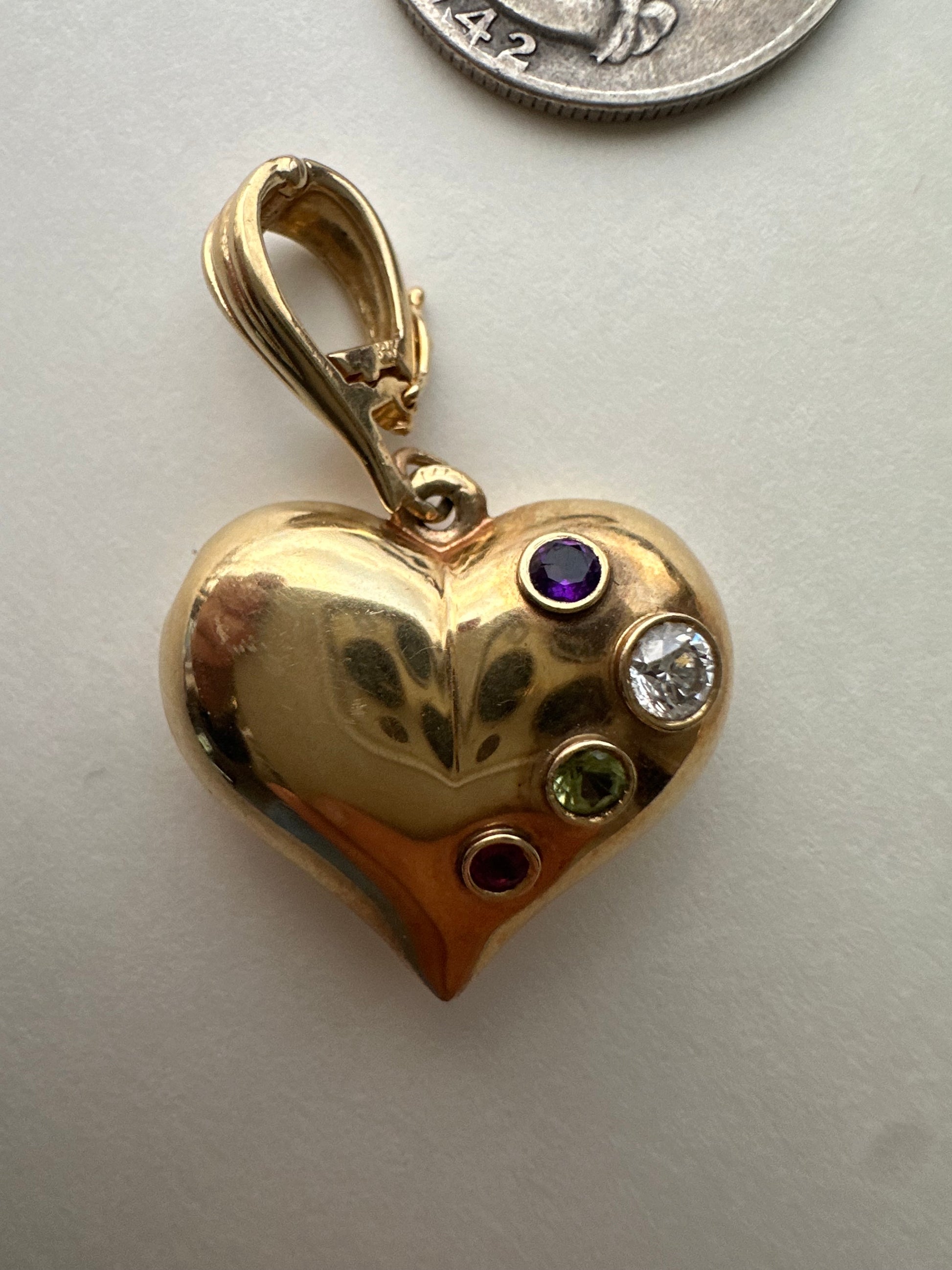 large puffed heart with gemstones and diamond