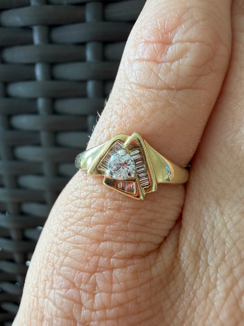 triangle ring with baguettes and round diamond