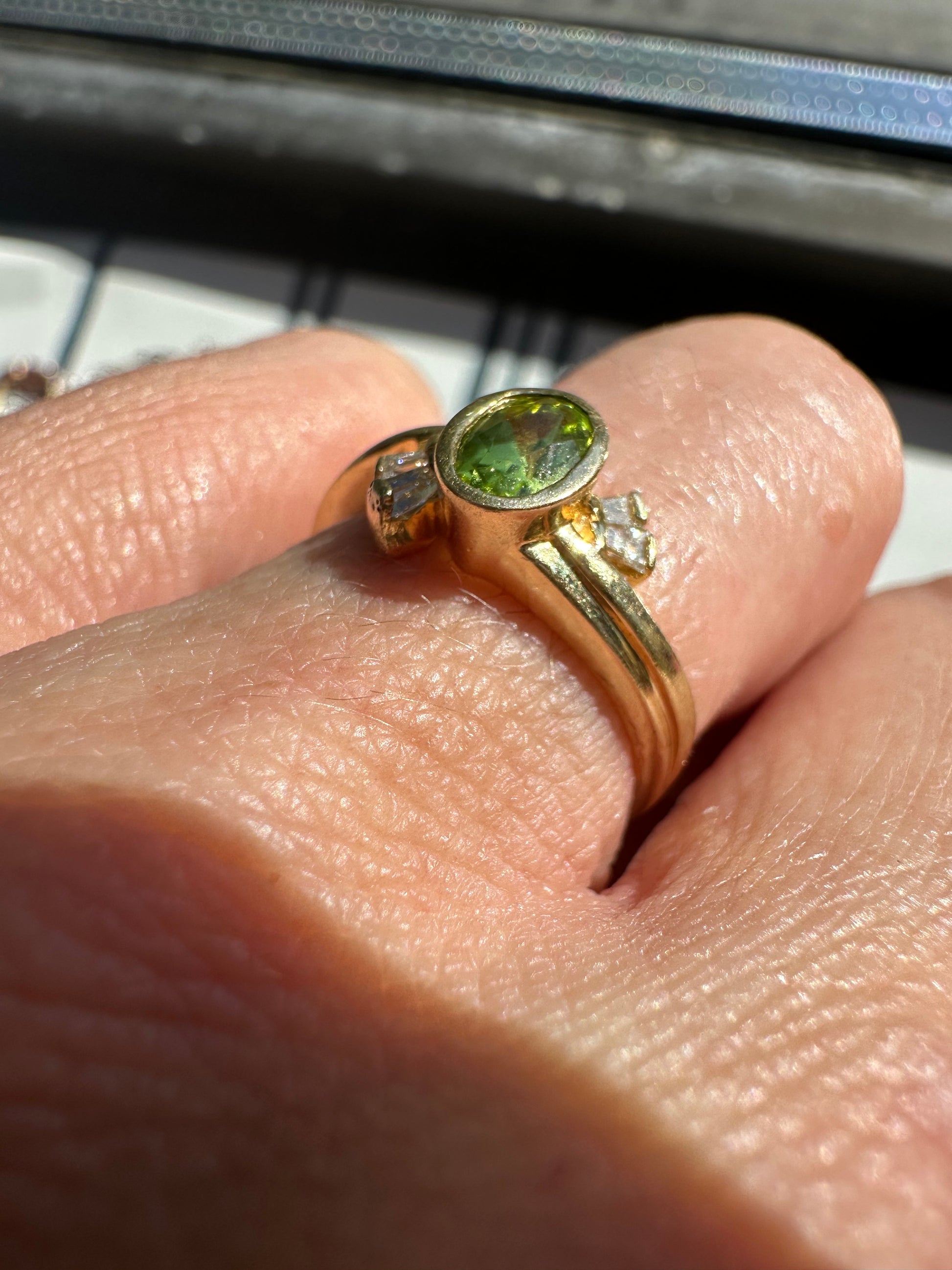 bezel set peridot and diamond ring