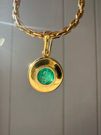 emerald in 18k bezel