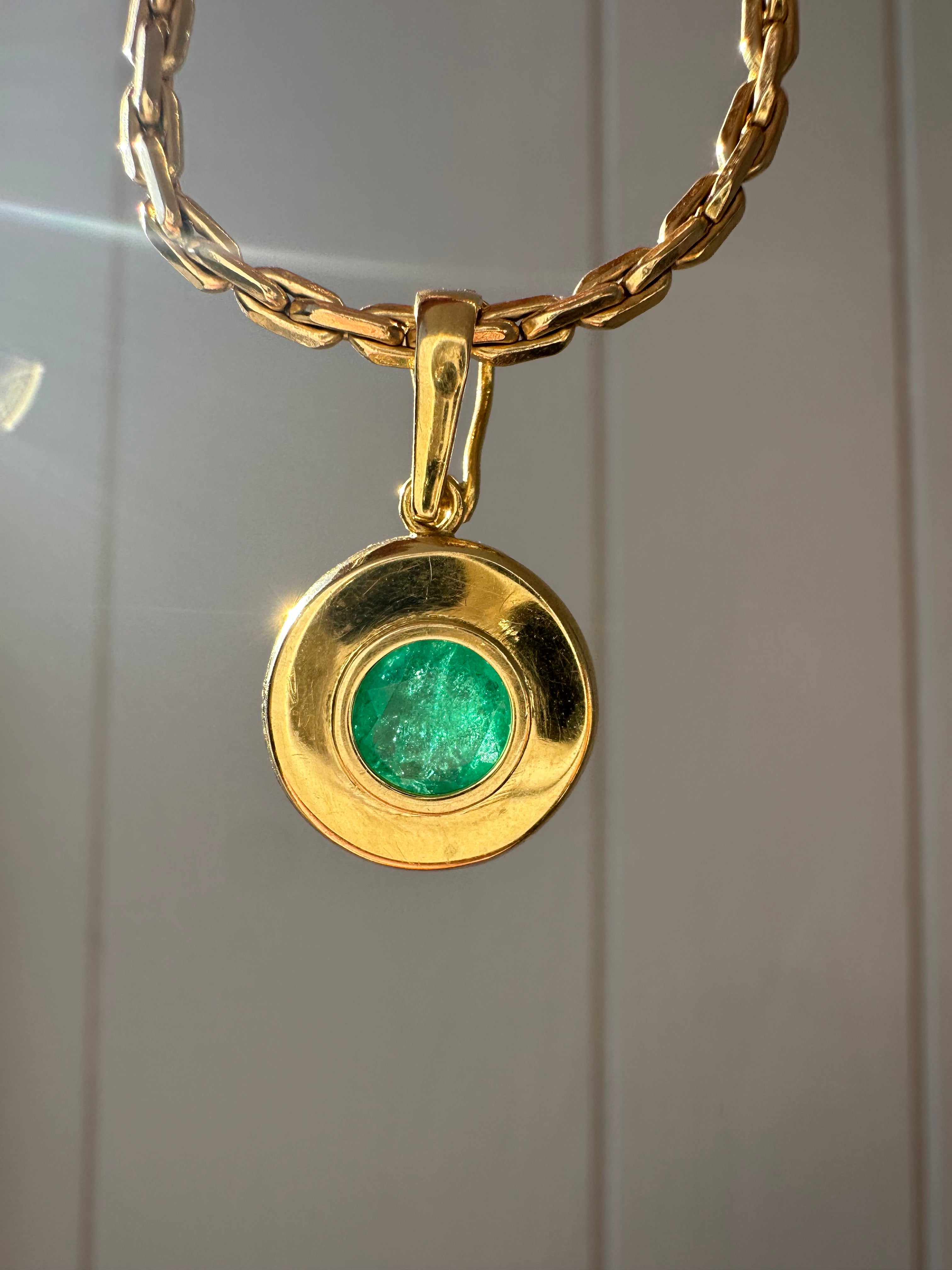 emerald in 18k bezel