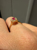 oval cut ruby with natural diamond halo