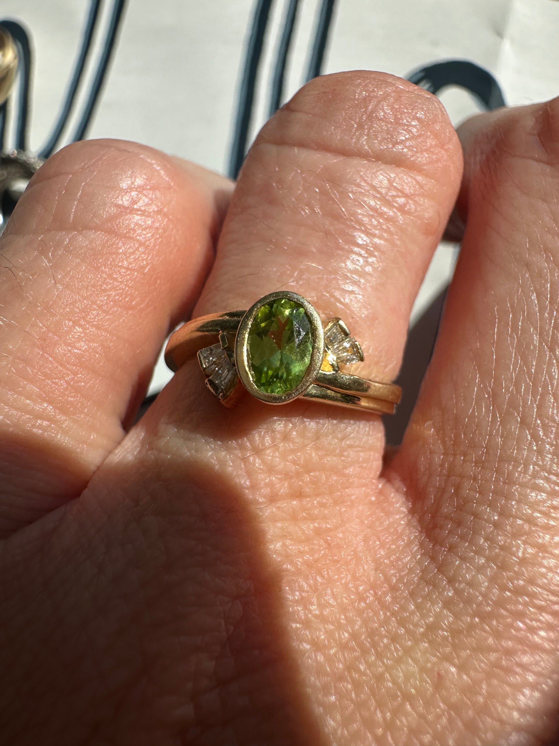 bezel set peridot and diamond ring