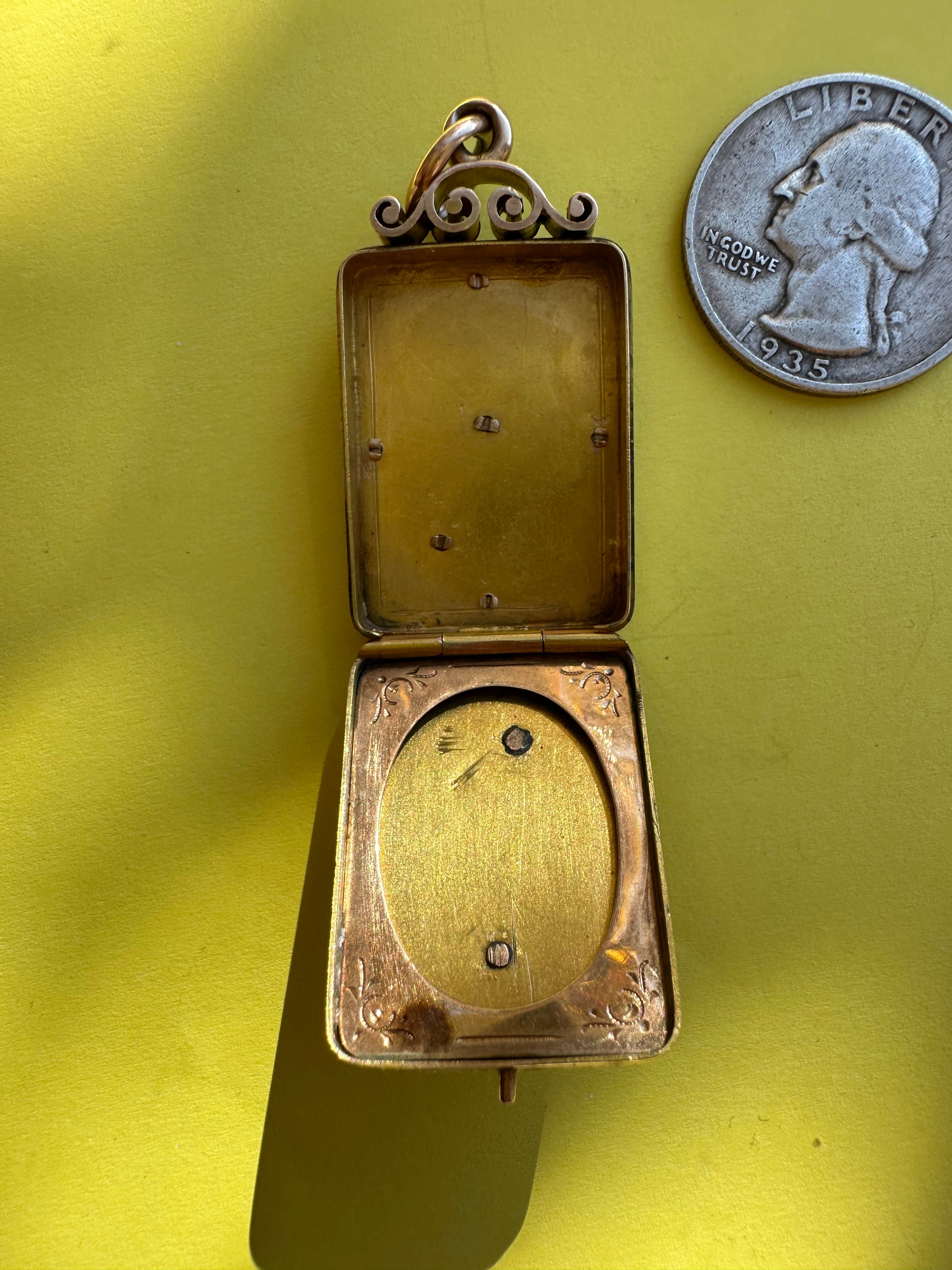 antique two sided locket with elk and monogram