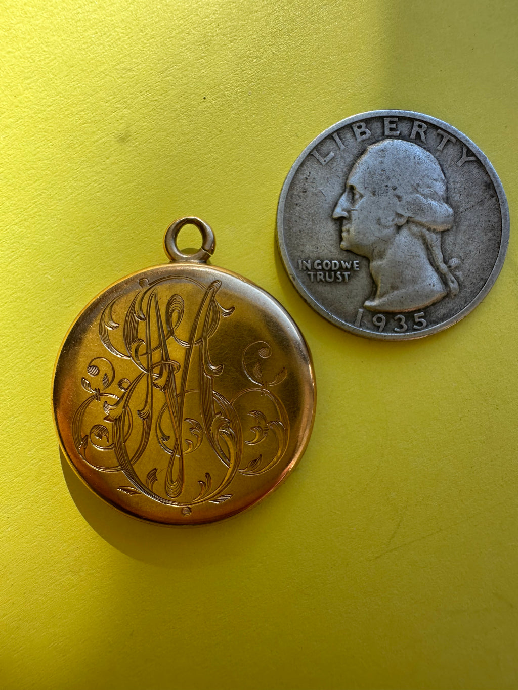 antique round engraved locket