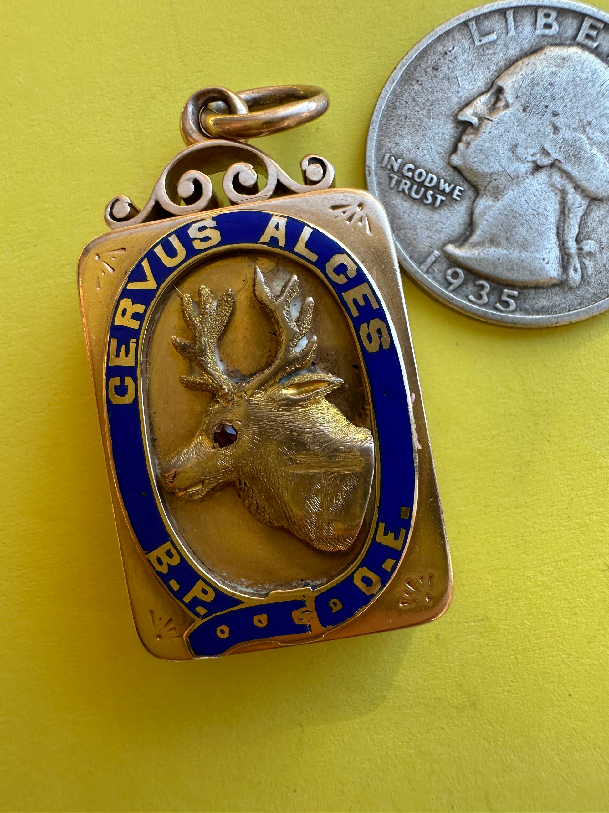 antique two sided locket with elk and monogram
