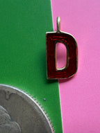 red enamel letter D