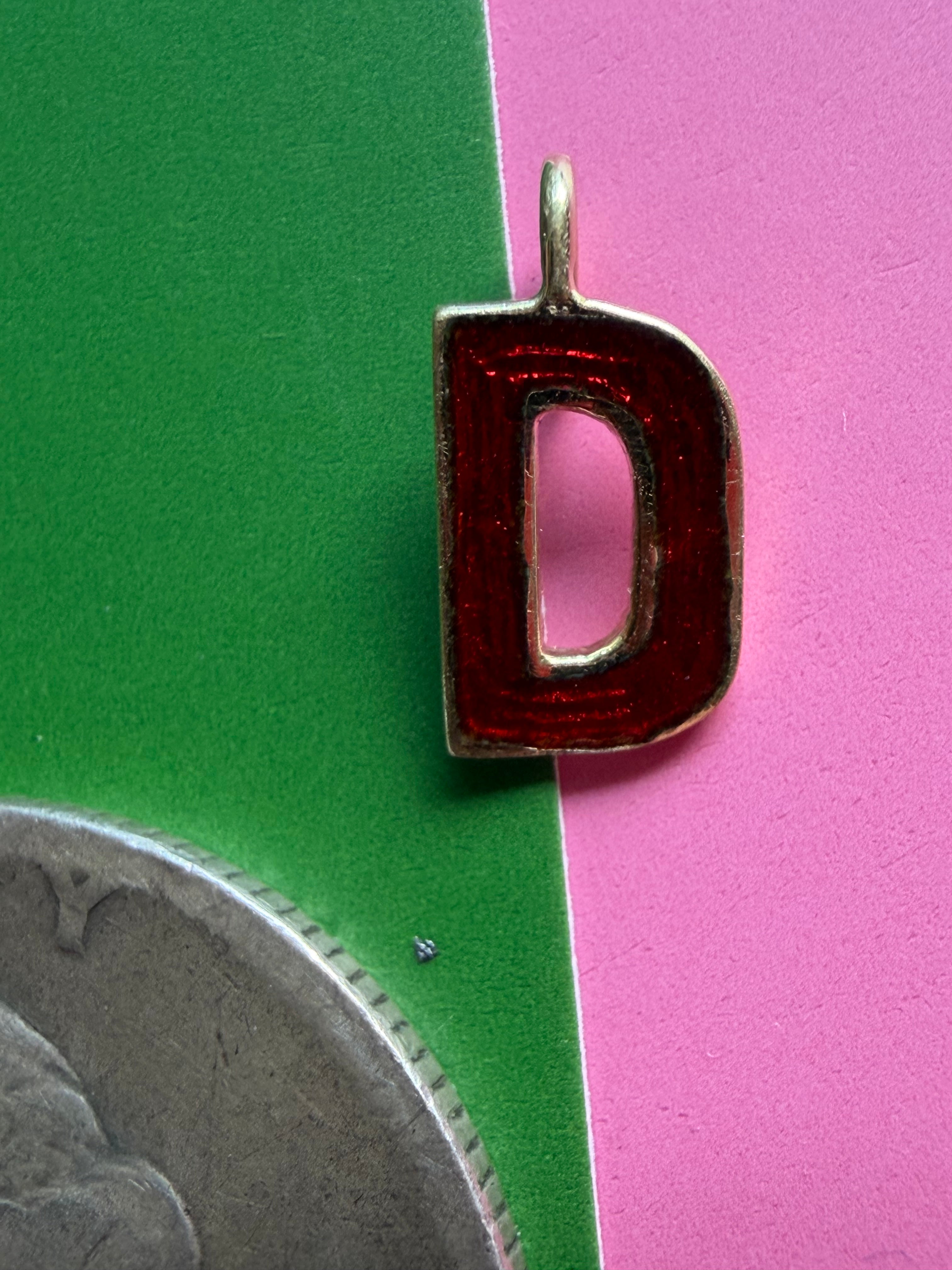 red enamel letter D