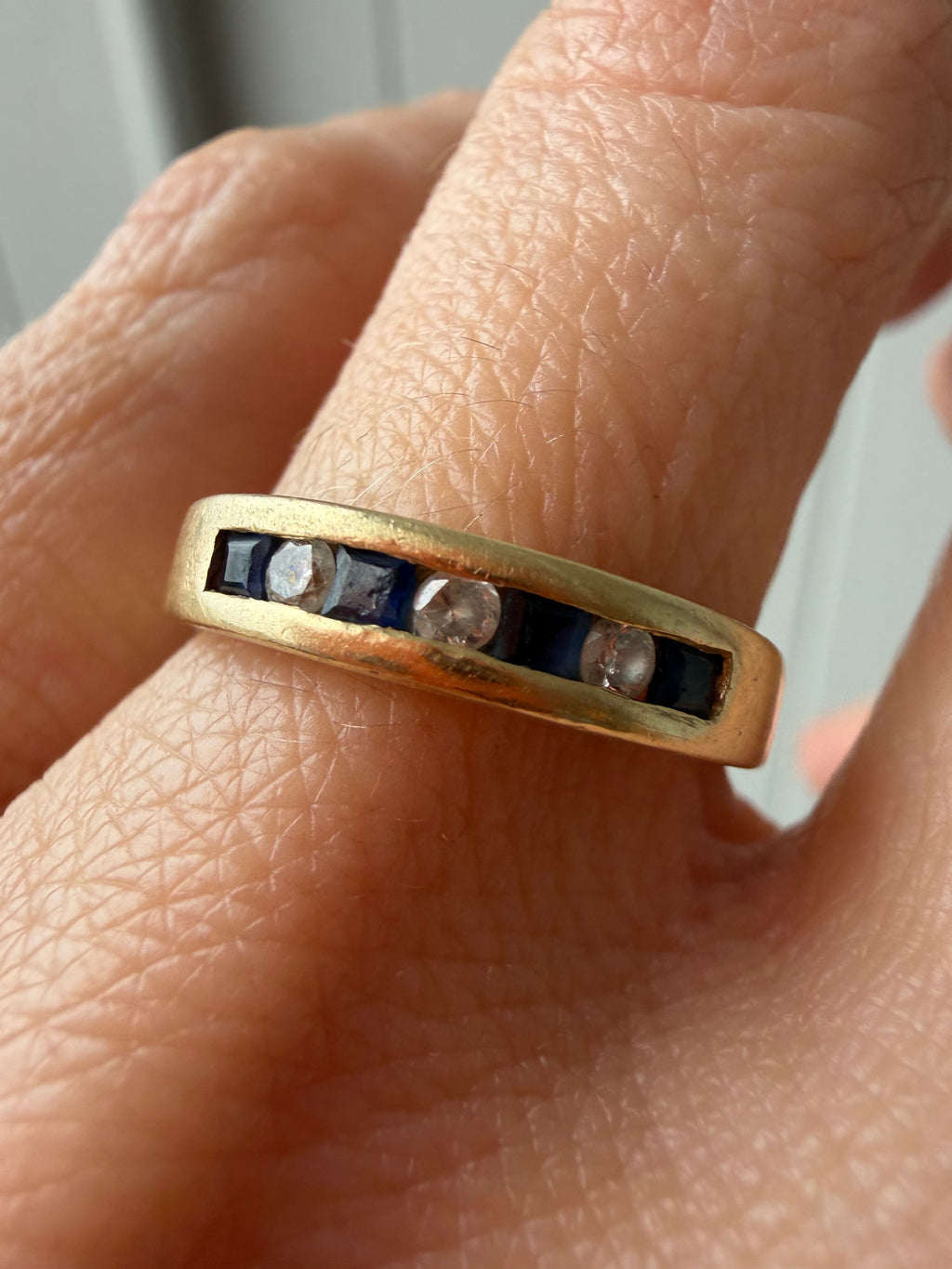 channel set sapphire and diamond band