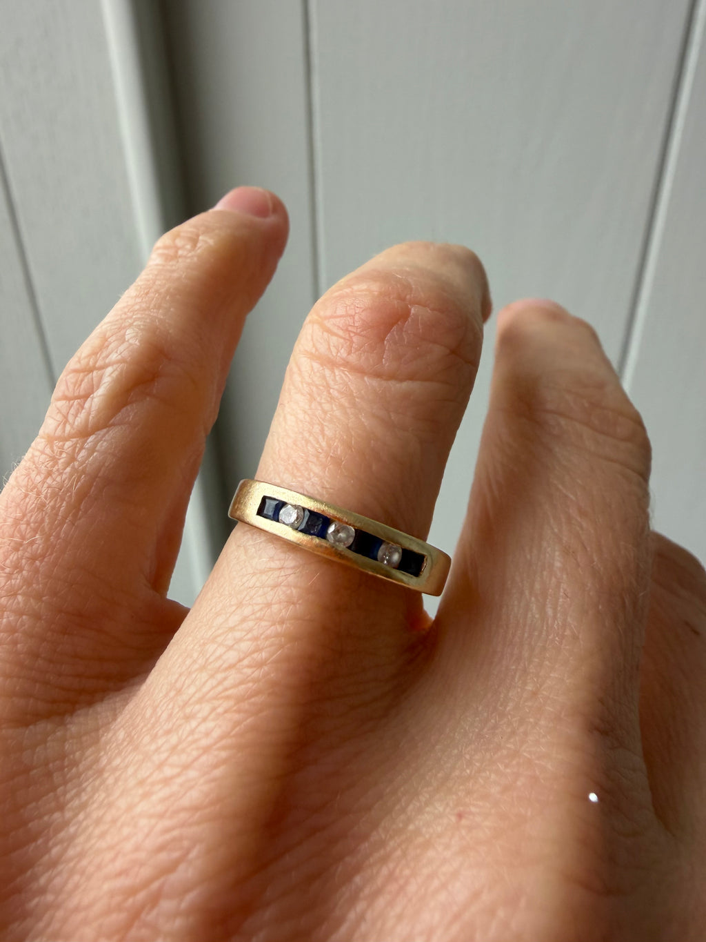 channel set sapphire and diamond band
