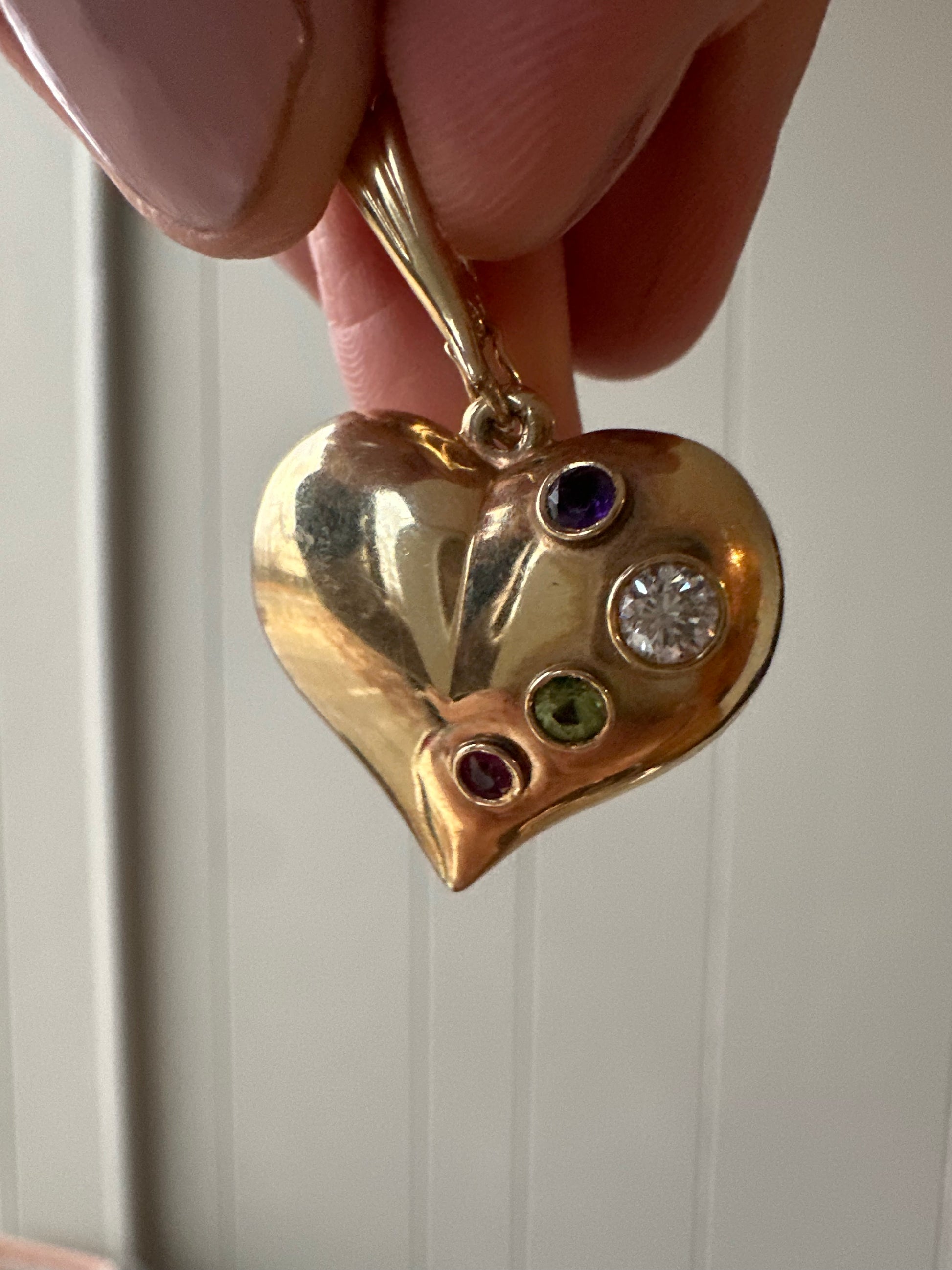 large puffed heart with gemstones and diamond