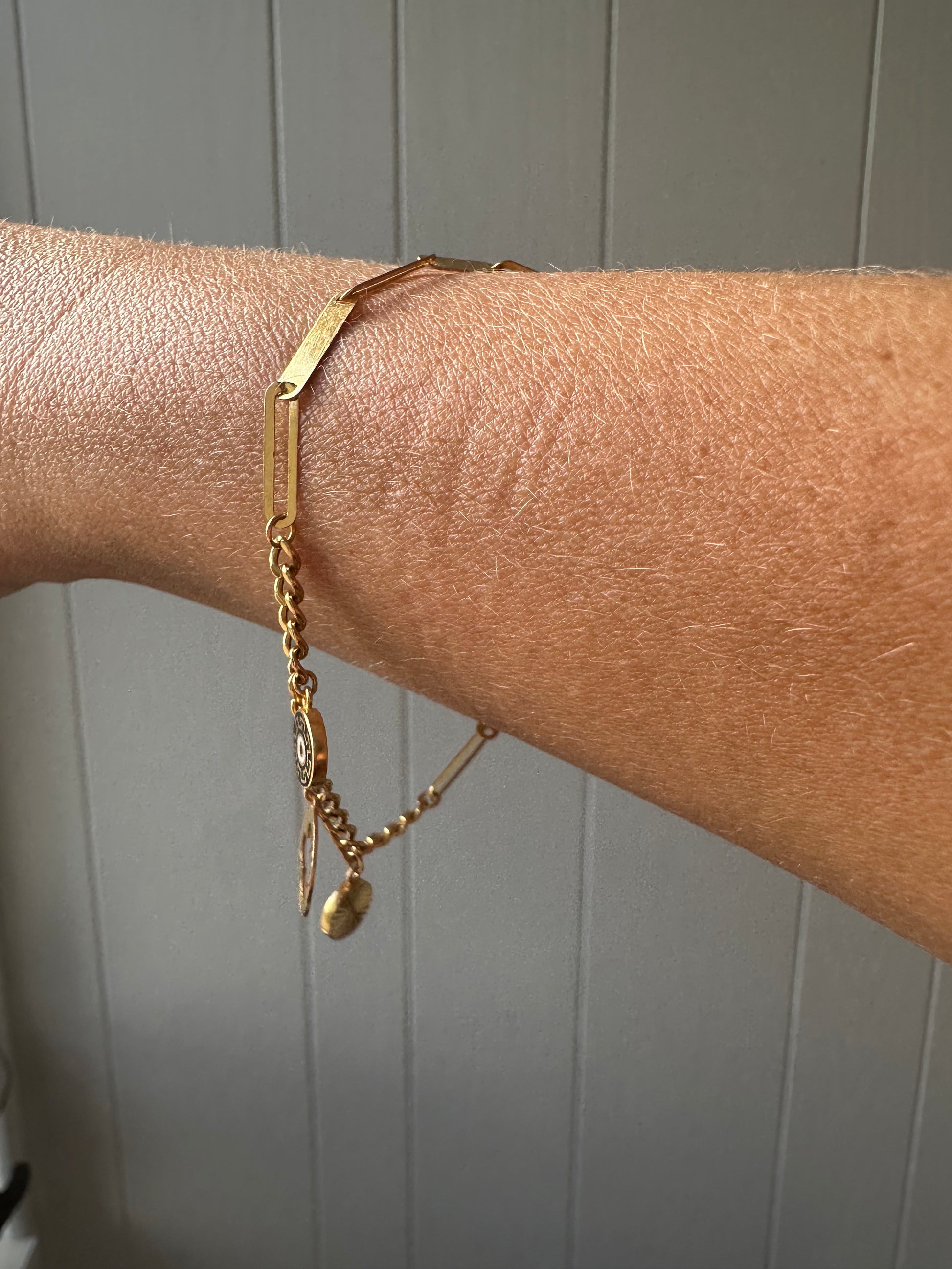 21k gold paperlink and curb charm bracelet