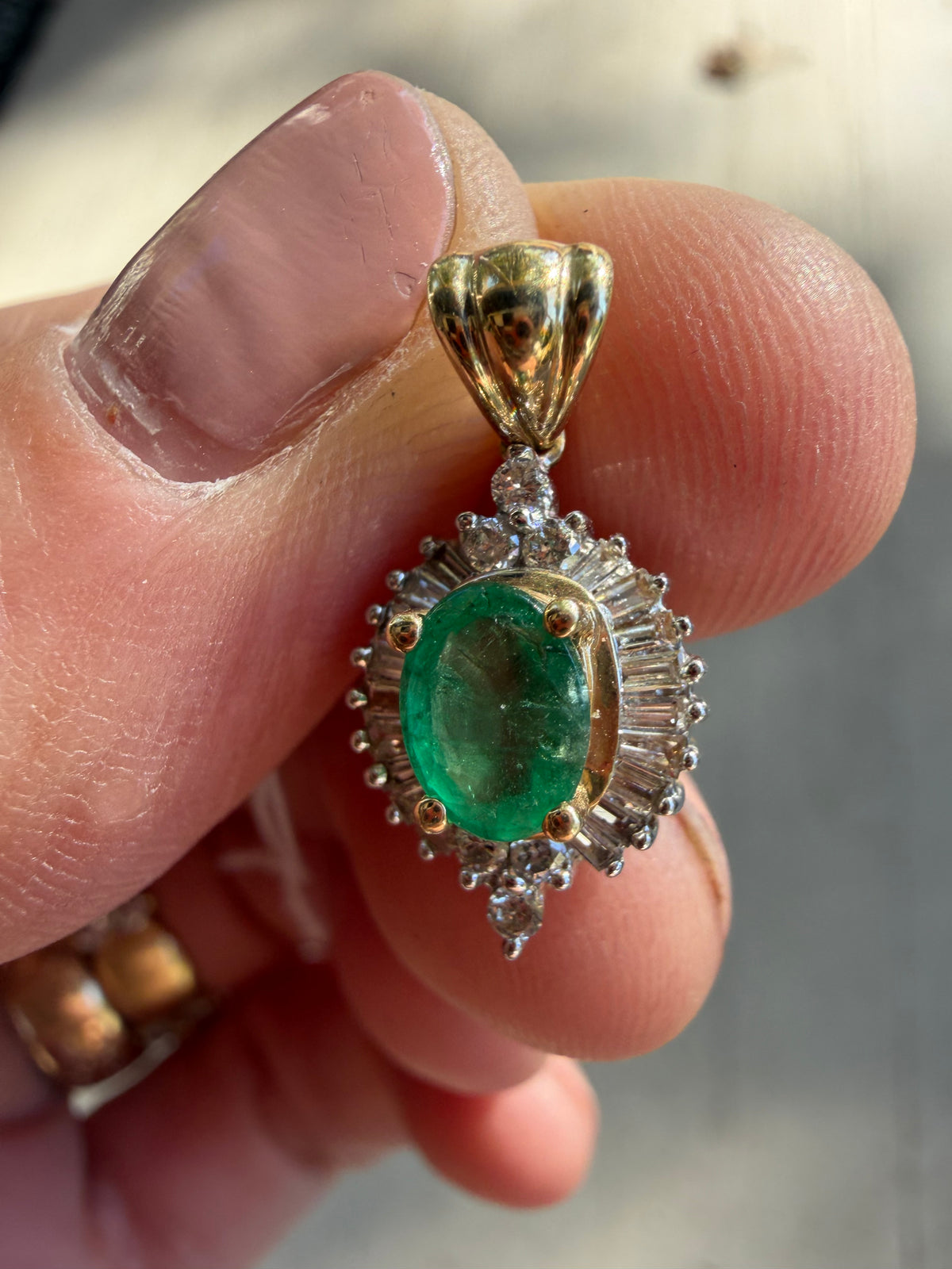 natural emerald and baguette diamond halo pendant
