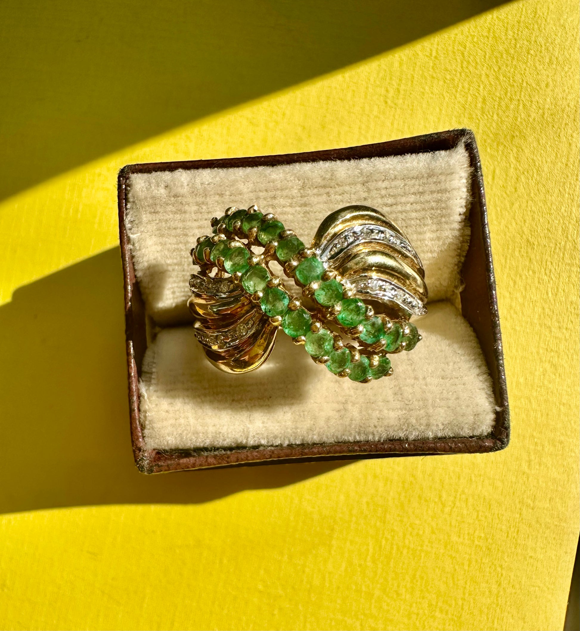 emerald and diamond swoop ring